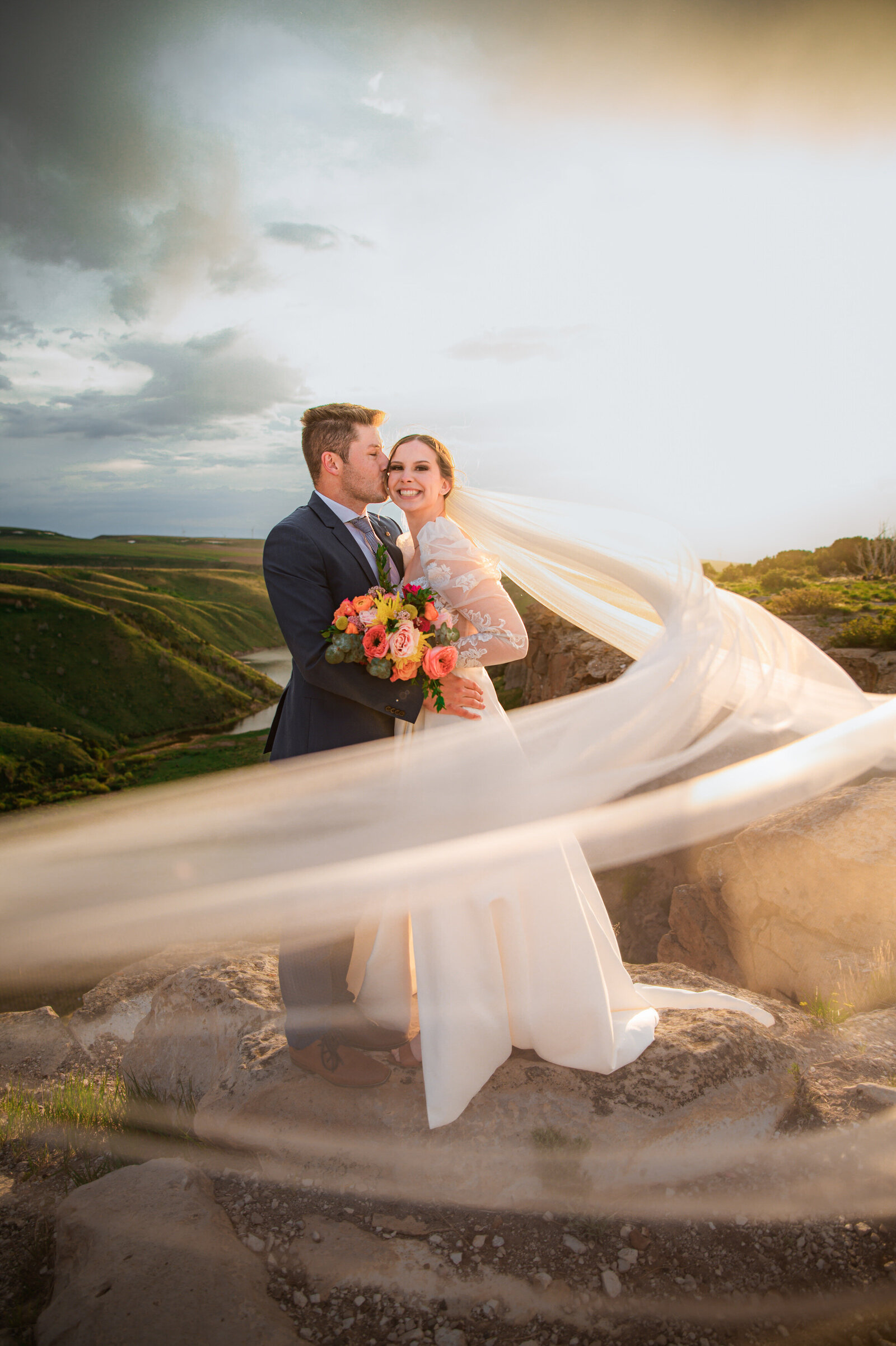 Jackson Hole photographers capture couple with veil during bridal portraits