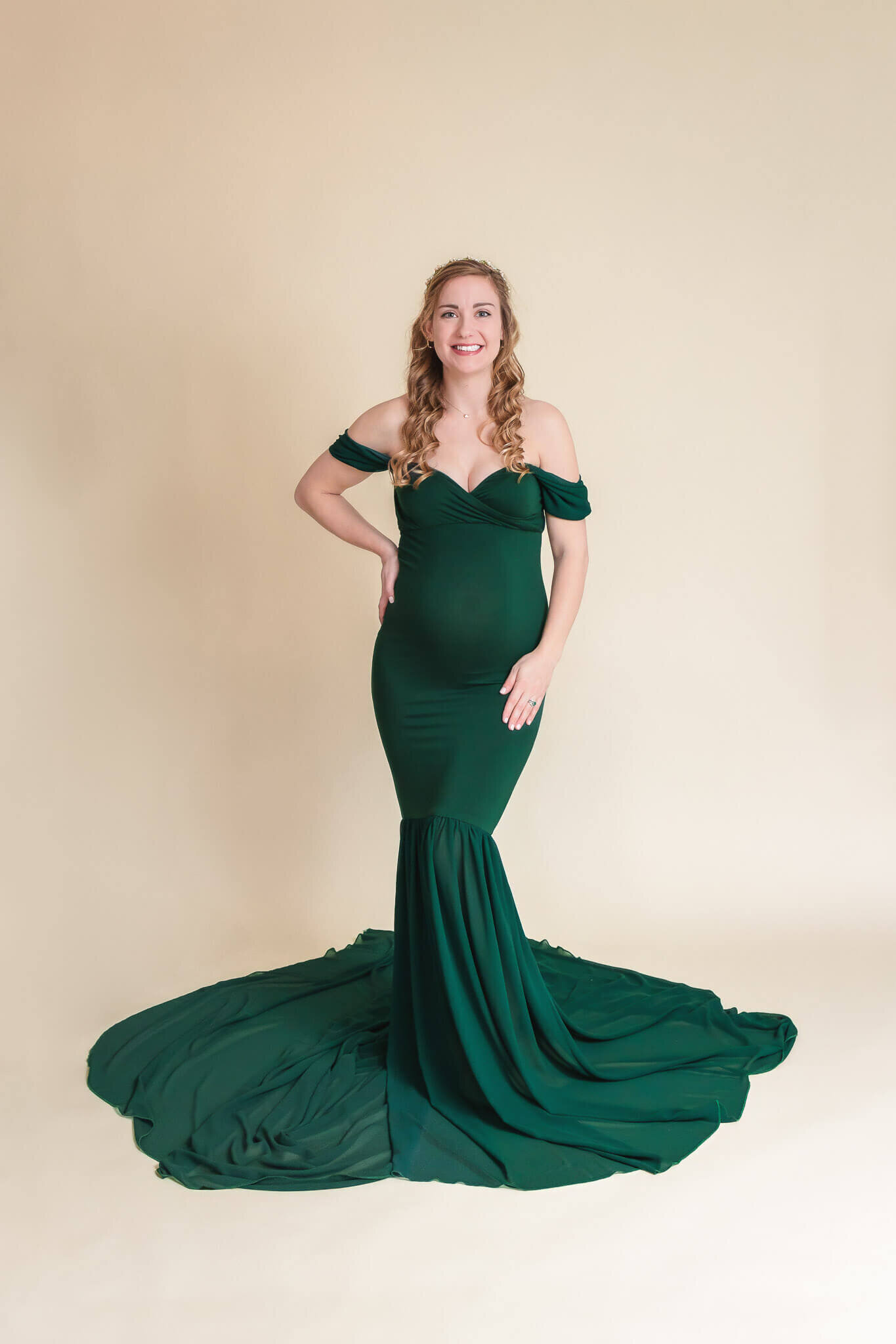 A Northern VA maternity studio session featuring a gorgeous mom in a green dress.