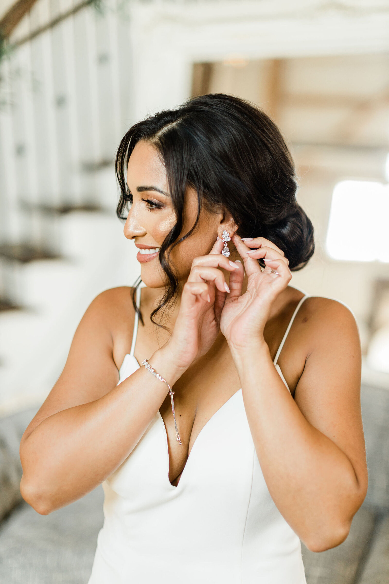 Bride Putting in Earrings | Cleveland OH | The Axtells Photo and Film