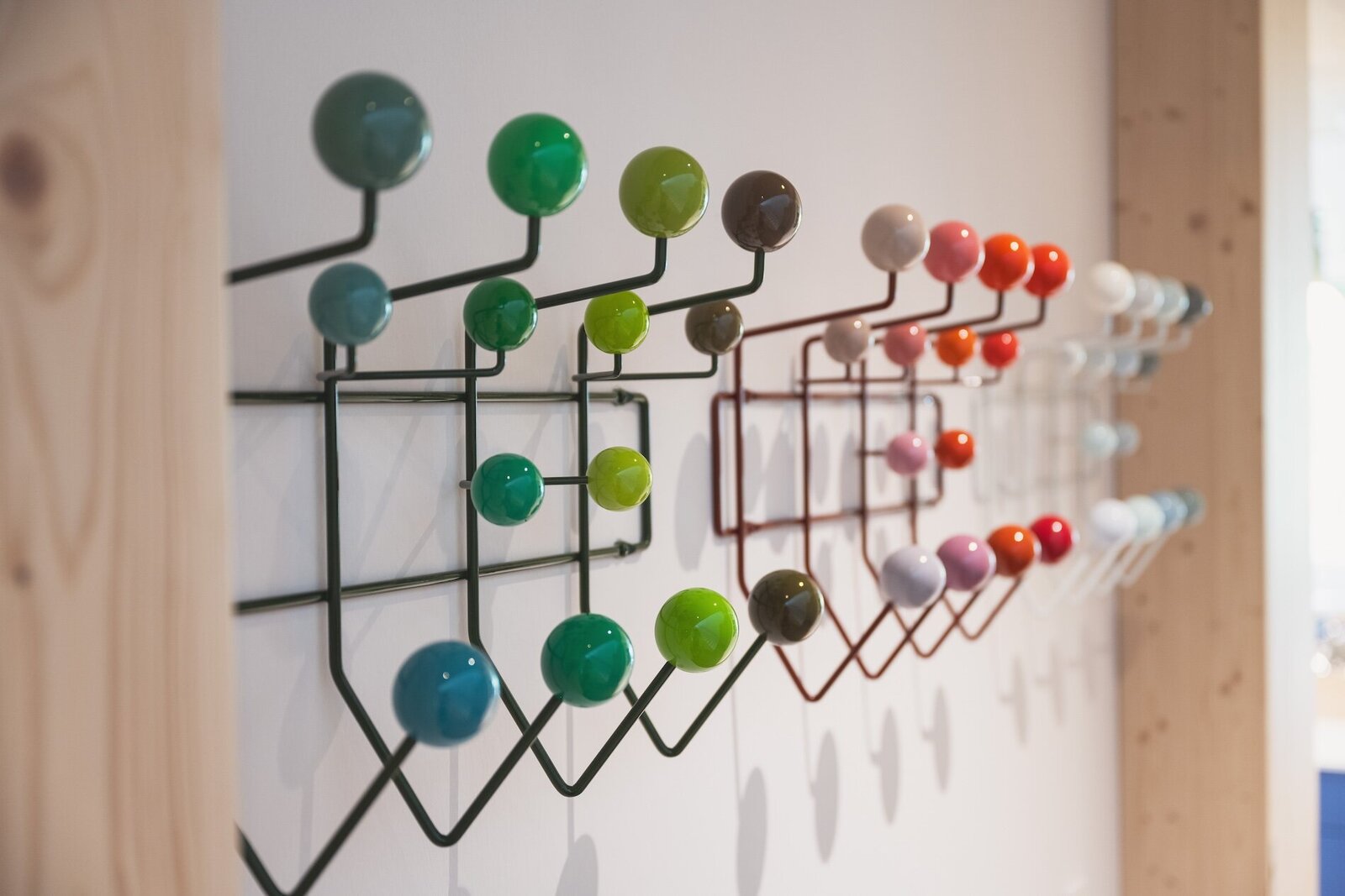 Designer clothing hooks inside The Campus Alps Workbase, adding a stylish and functional touch to the workspace, perfect for remote workers and company retreats in the scenic Alps.