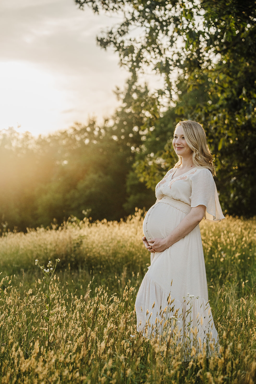 pregnant mom in cream dress for maternity photos