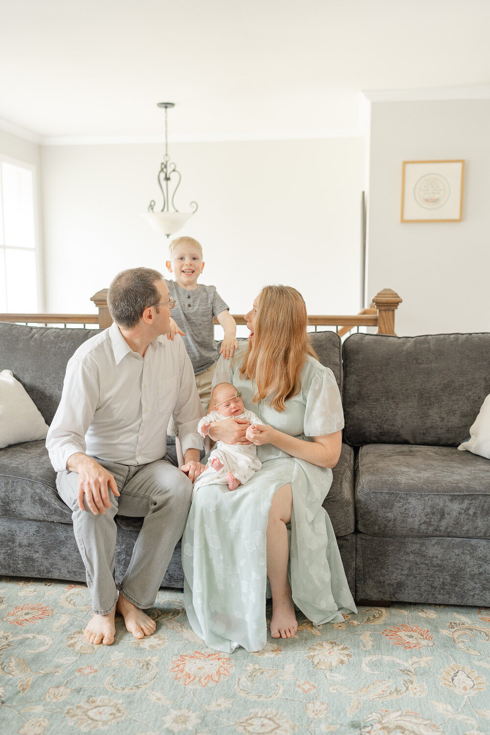family playing during newborn picture in Fairfax, County, Virginia