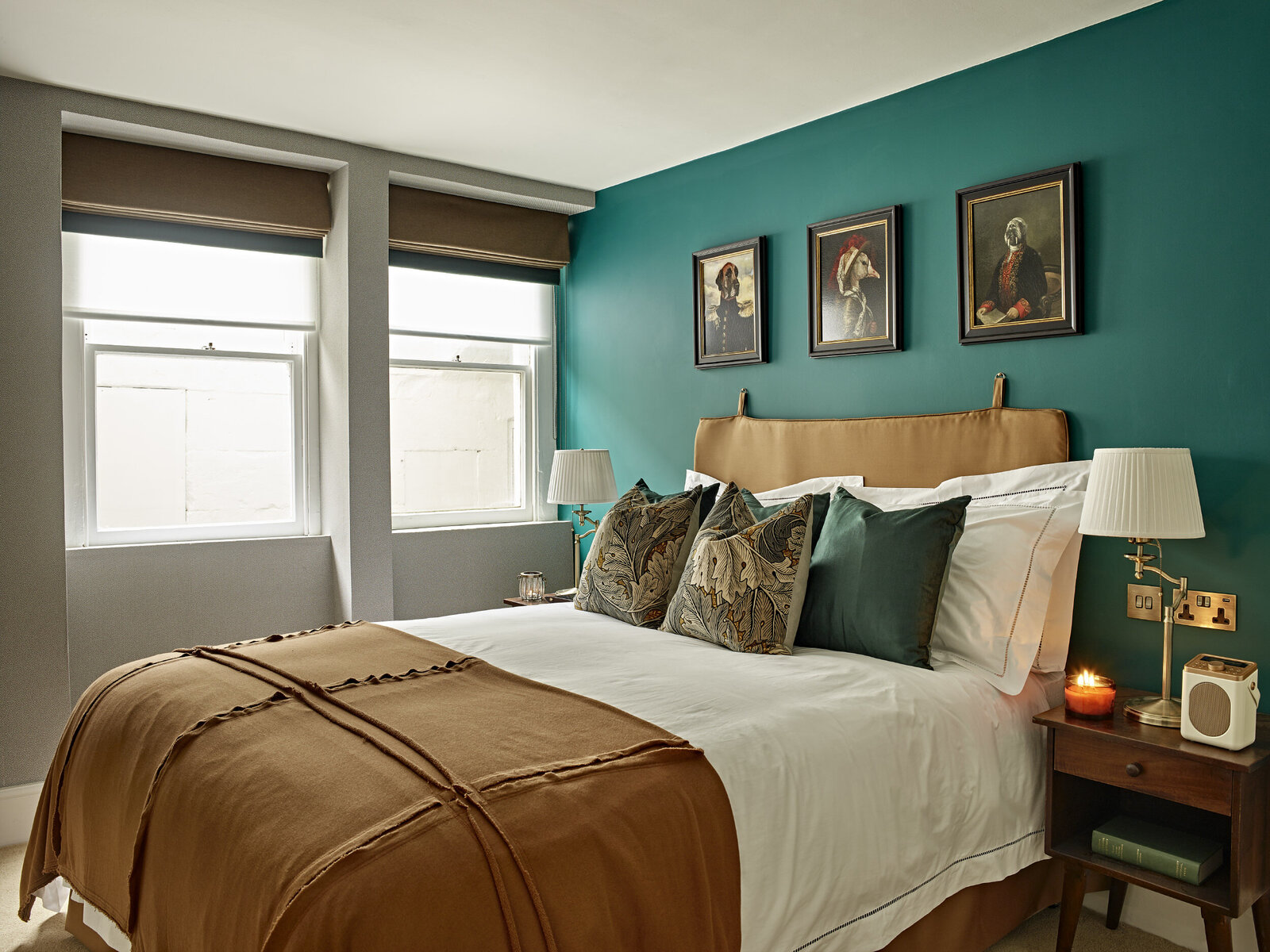 teal green wall with orange and white bedding