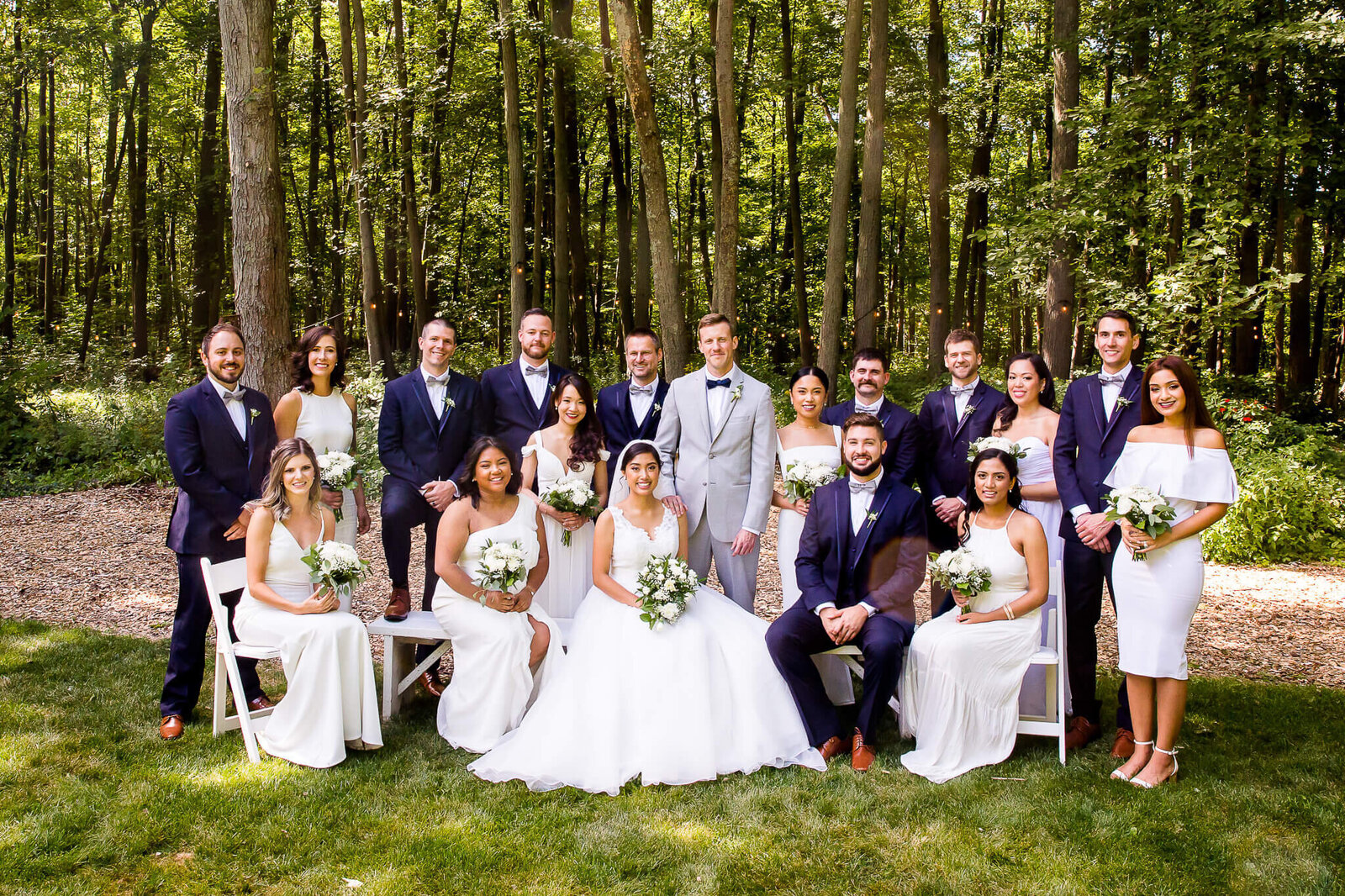 Wedding party portrait with bridesmaids and groomsmen.