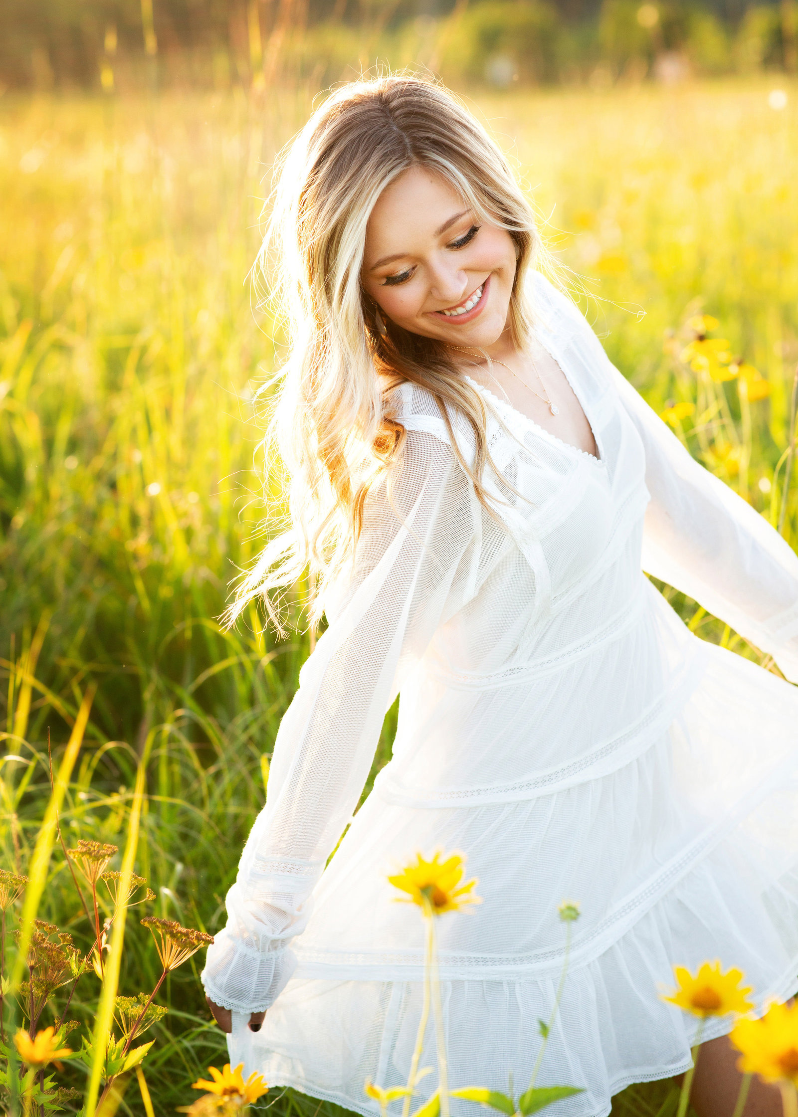 girl in white dress in flower field