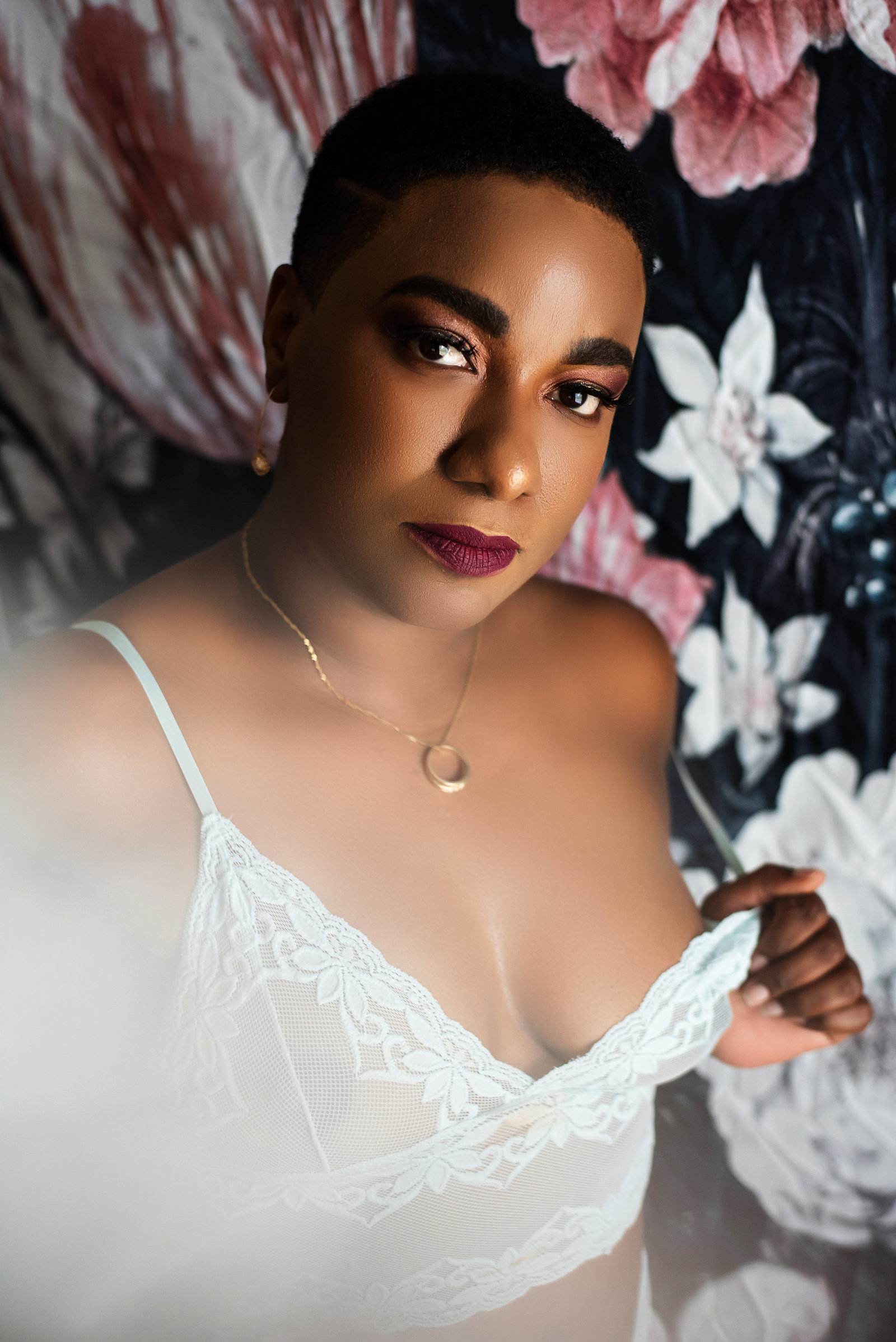 boudoir of young black woman against flowers