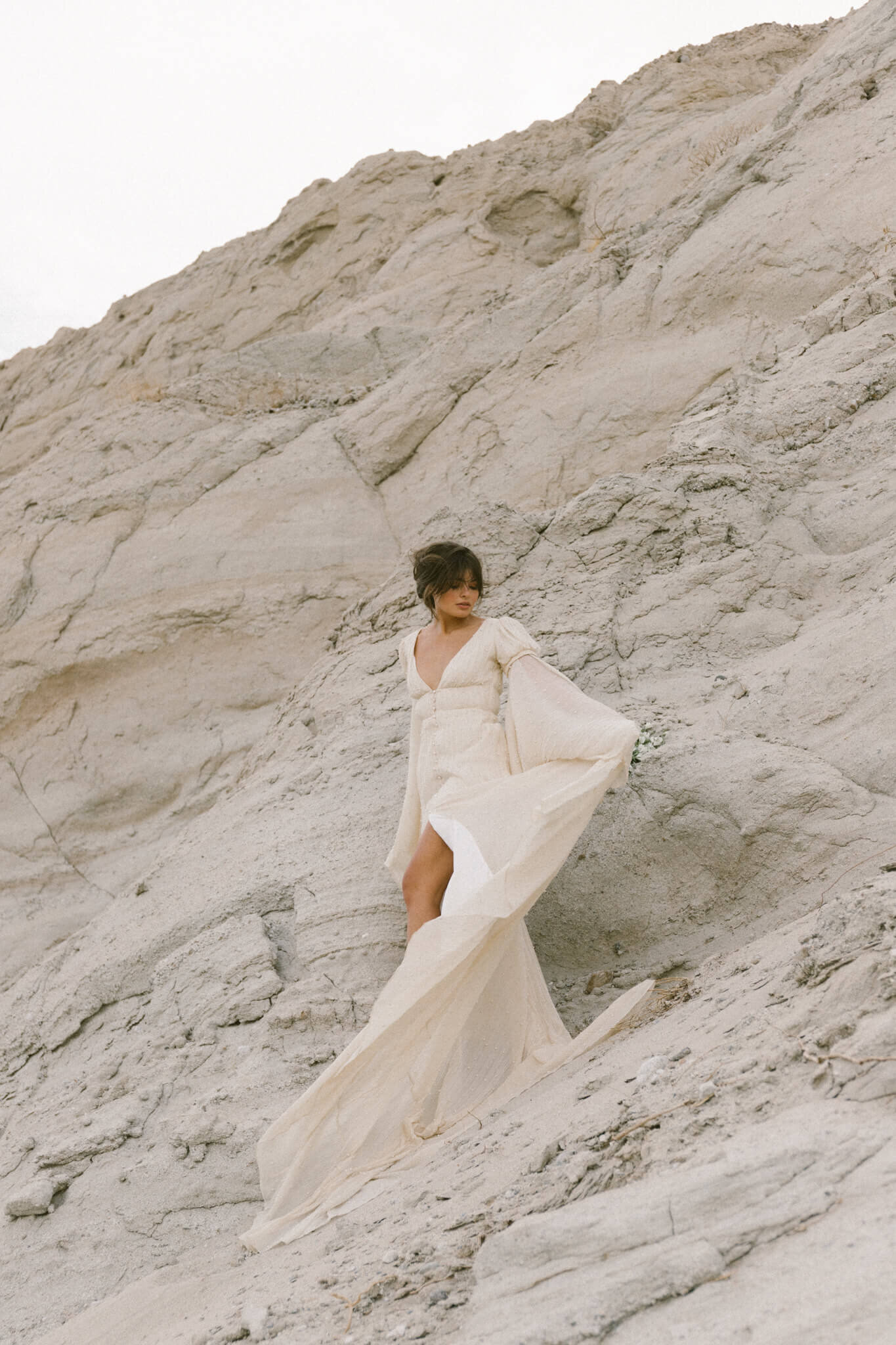 woman wearing wedding dress standing in nature