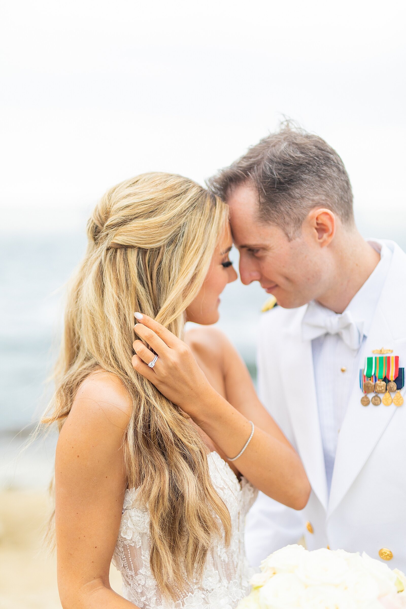 Bride and groom at La Jolla beach by Sherr Weddings.