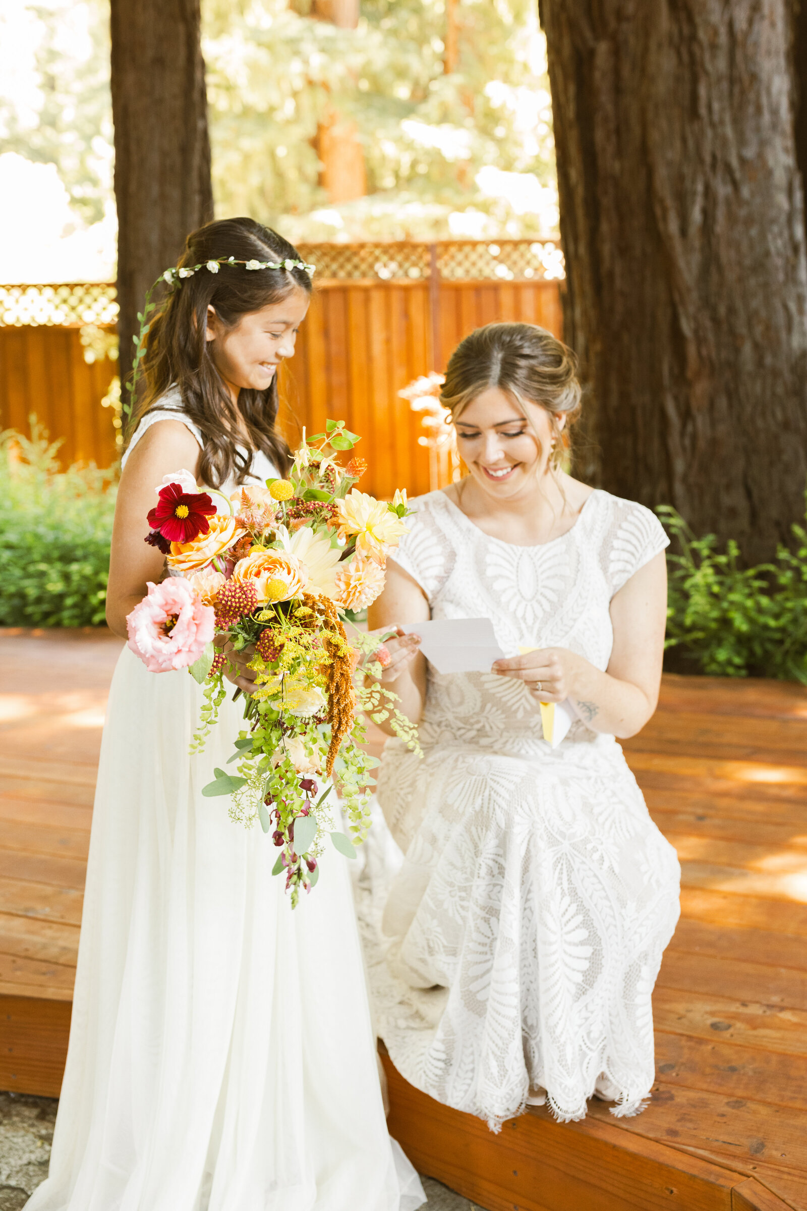 Bridal party at a colorful wedding ceremony in Santa Cruz, California in the redwood trees.