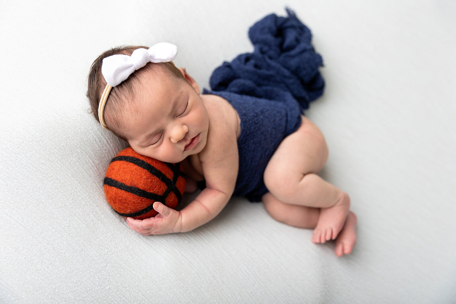 baby posing with basketball
