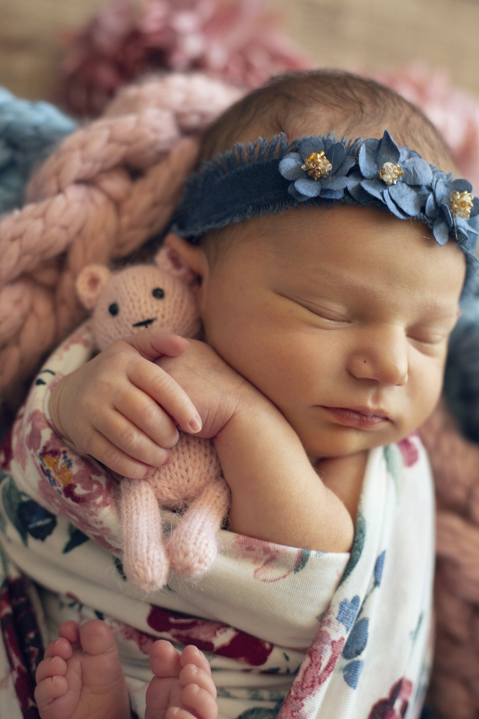 Newborn-photos-baby-girl-with-a-pink-teddy-bear