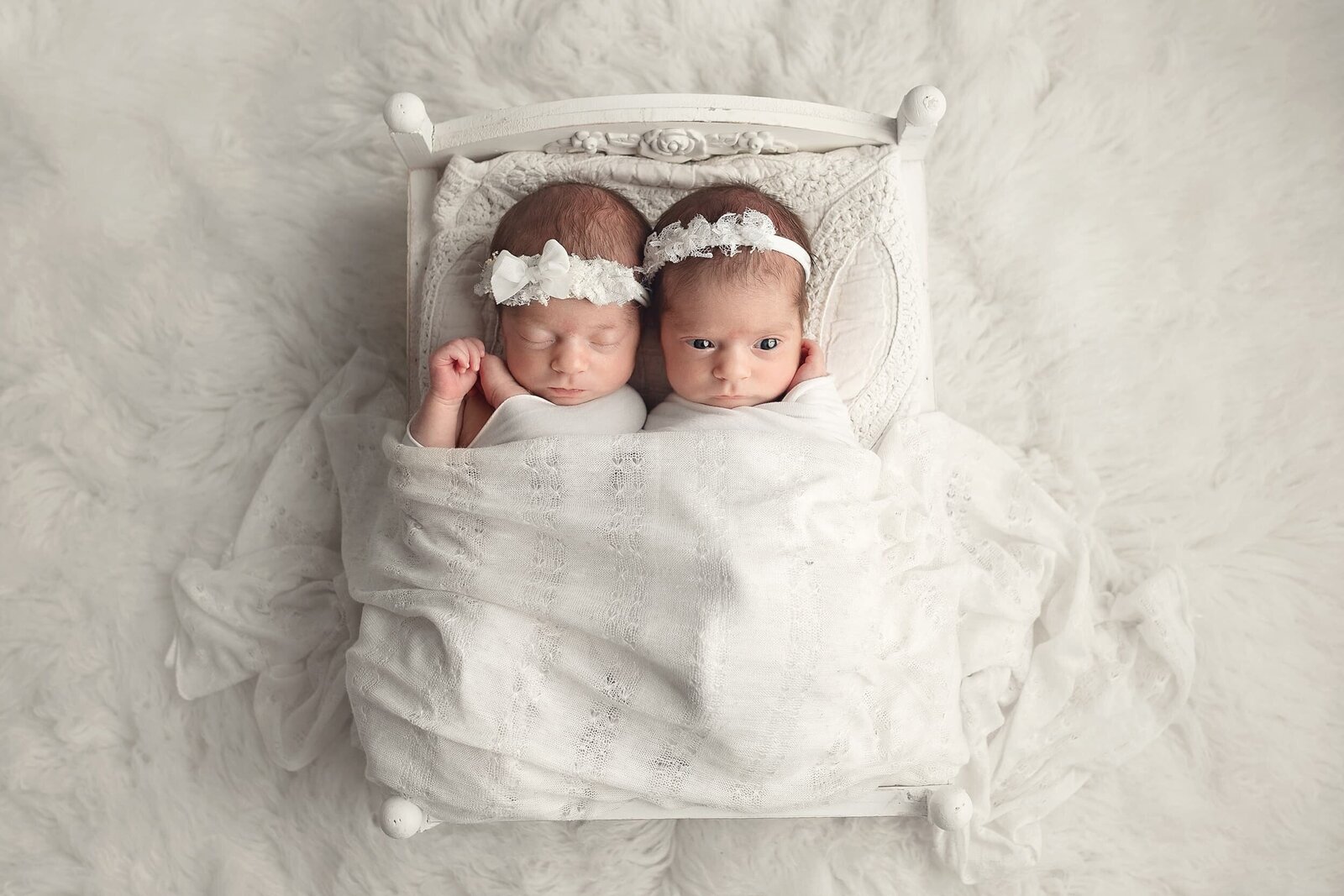 twin babies in bed prop