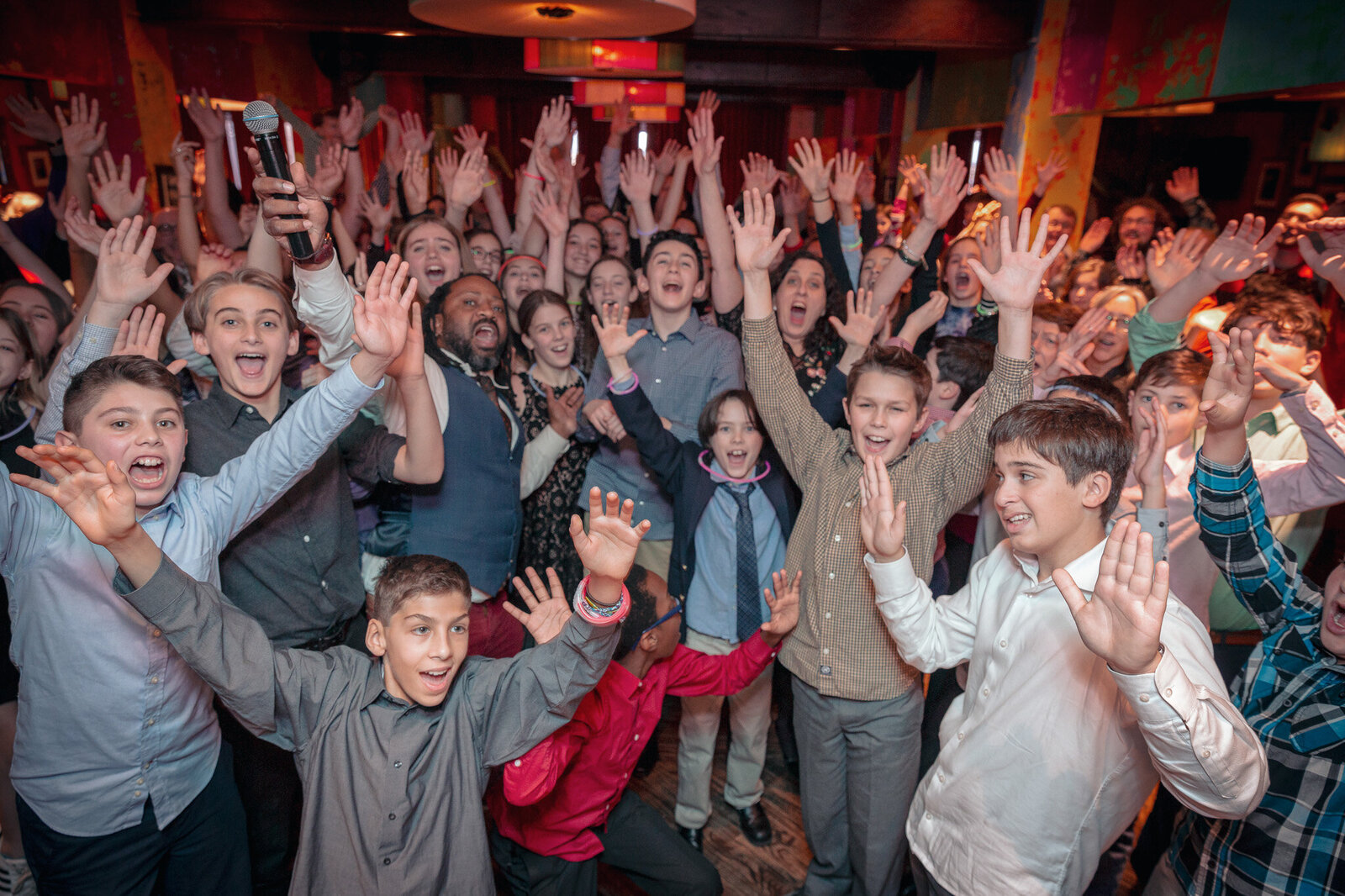 Crowd dancing and cheering at Chicago Bar Mitzvah with Charizma Entertainment DJ