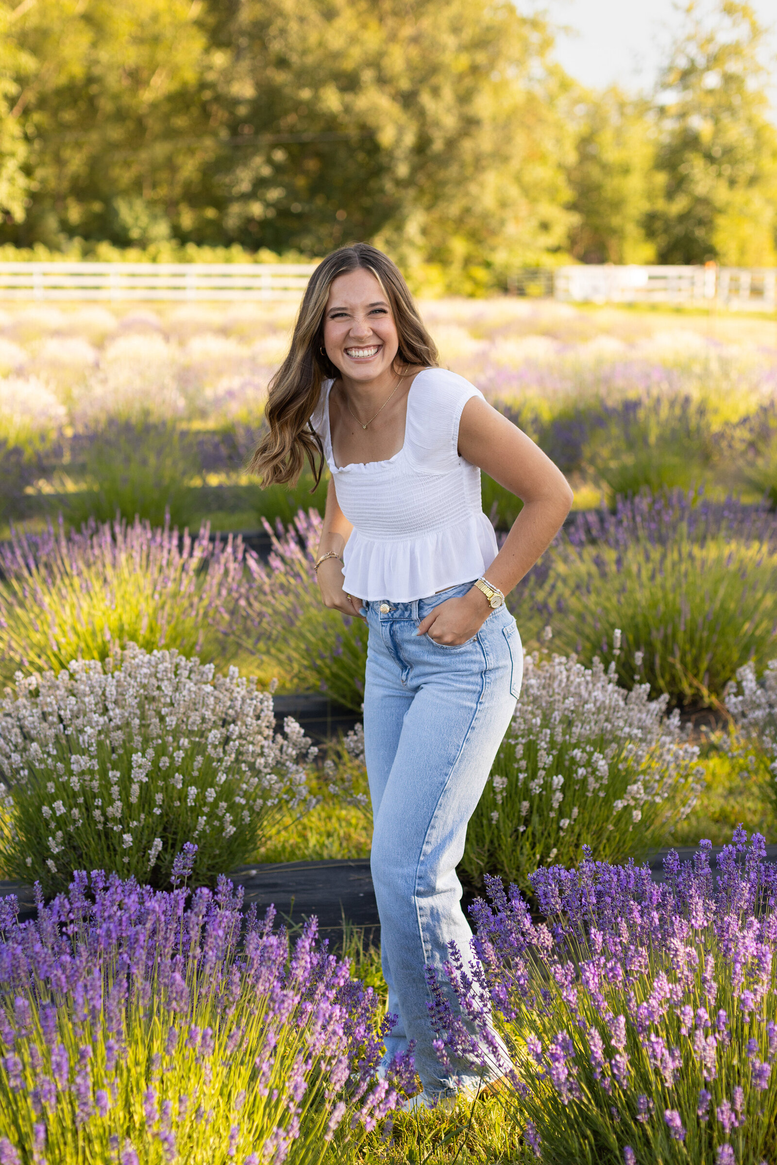 senior girl laughing in field of lavender fields