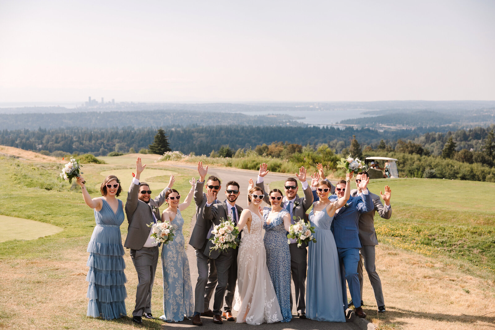 Bridal party wearing sunglasses standing on golf course