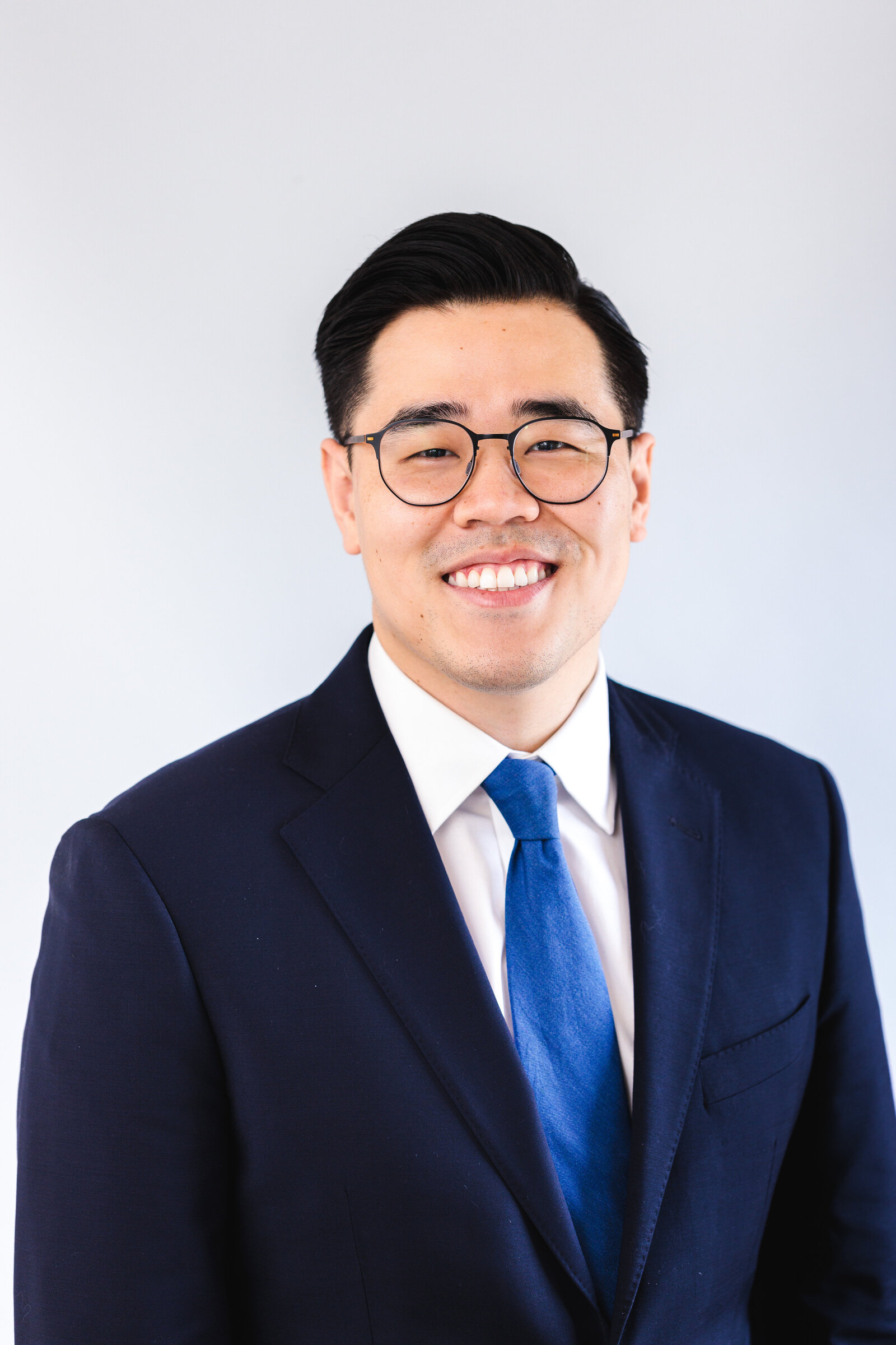 Man wearing glasses and suit for professional photo