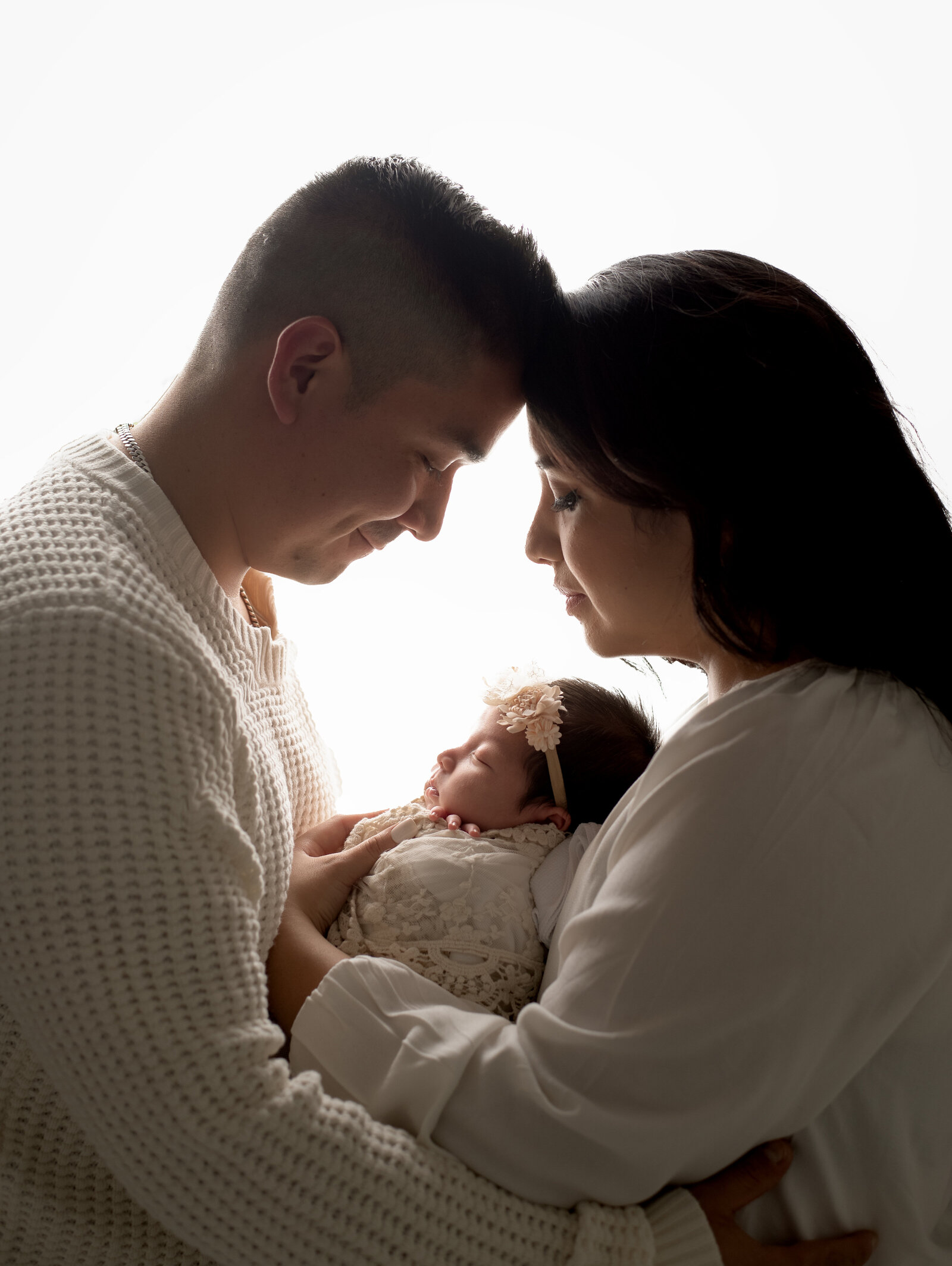 backlit family photoshoot studio family newborn photos
