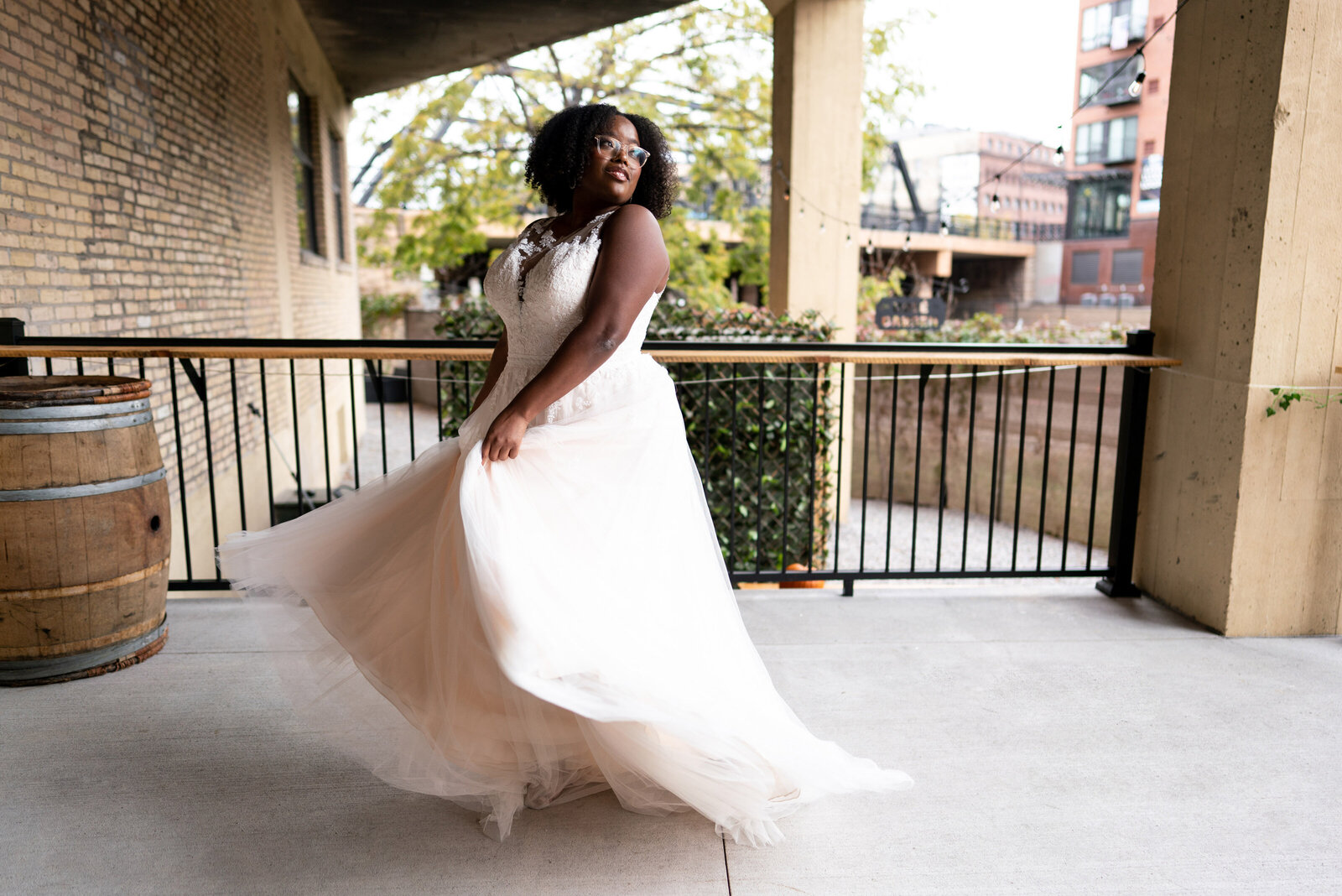 Black bride twirls wedding dress