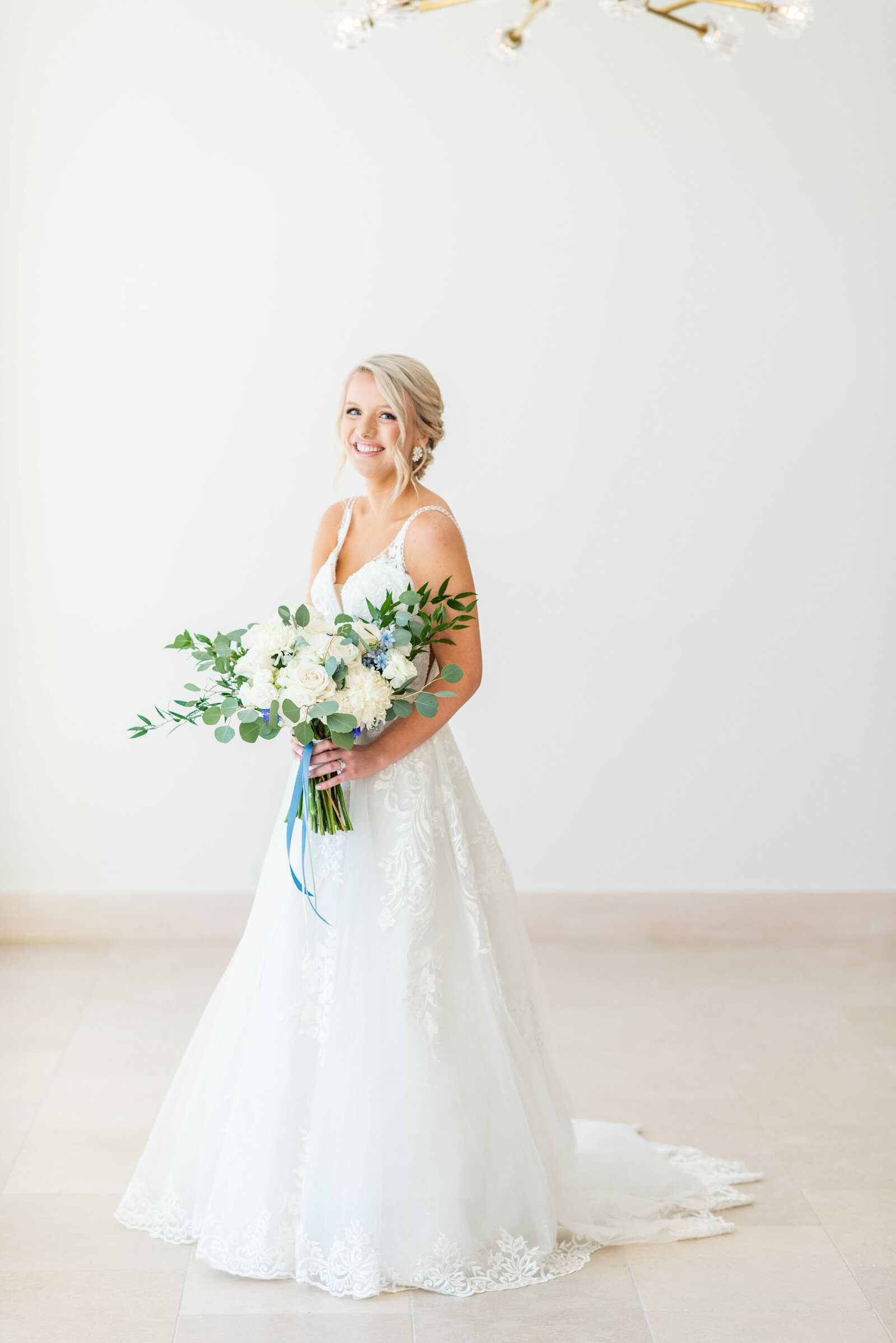 bride posing with flowers