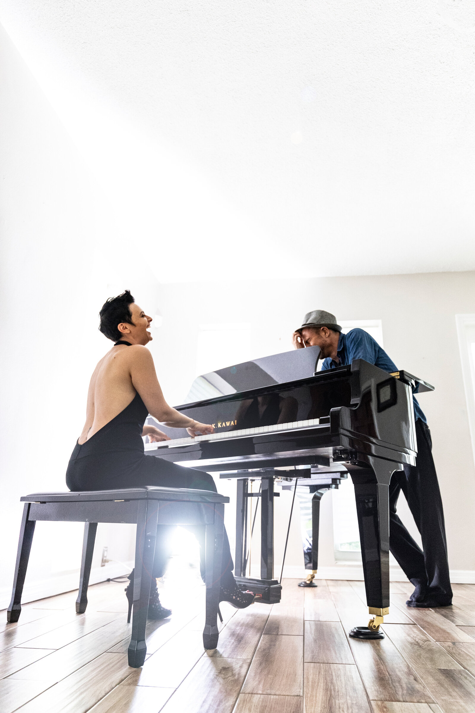 Commercial shoot of two musicians at a piano