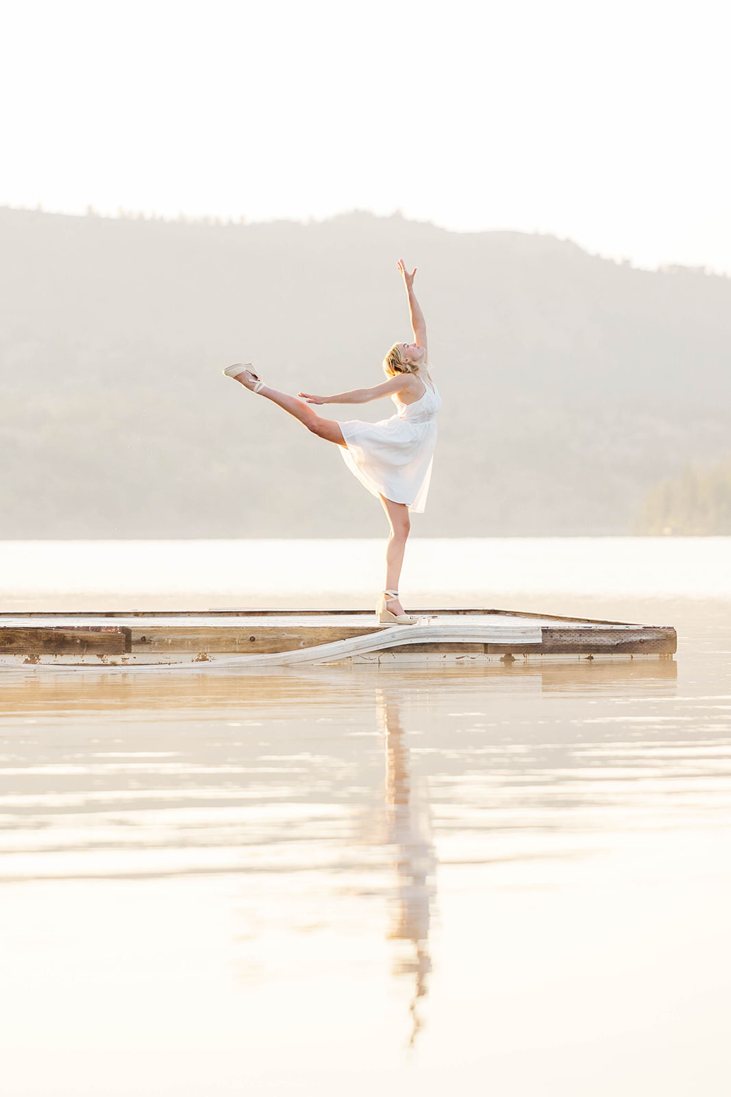 Girl doing a dance pose during her senior session near Pinedale, Wyoming.