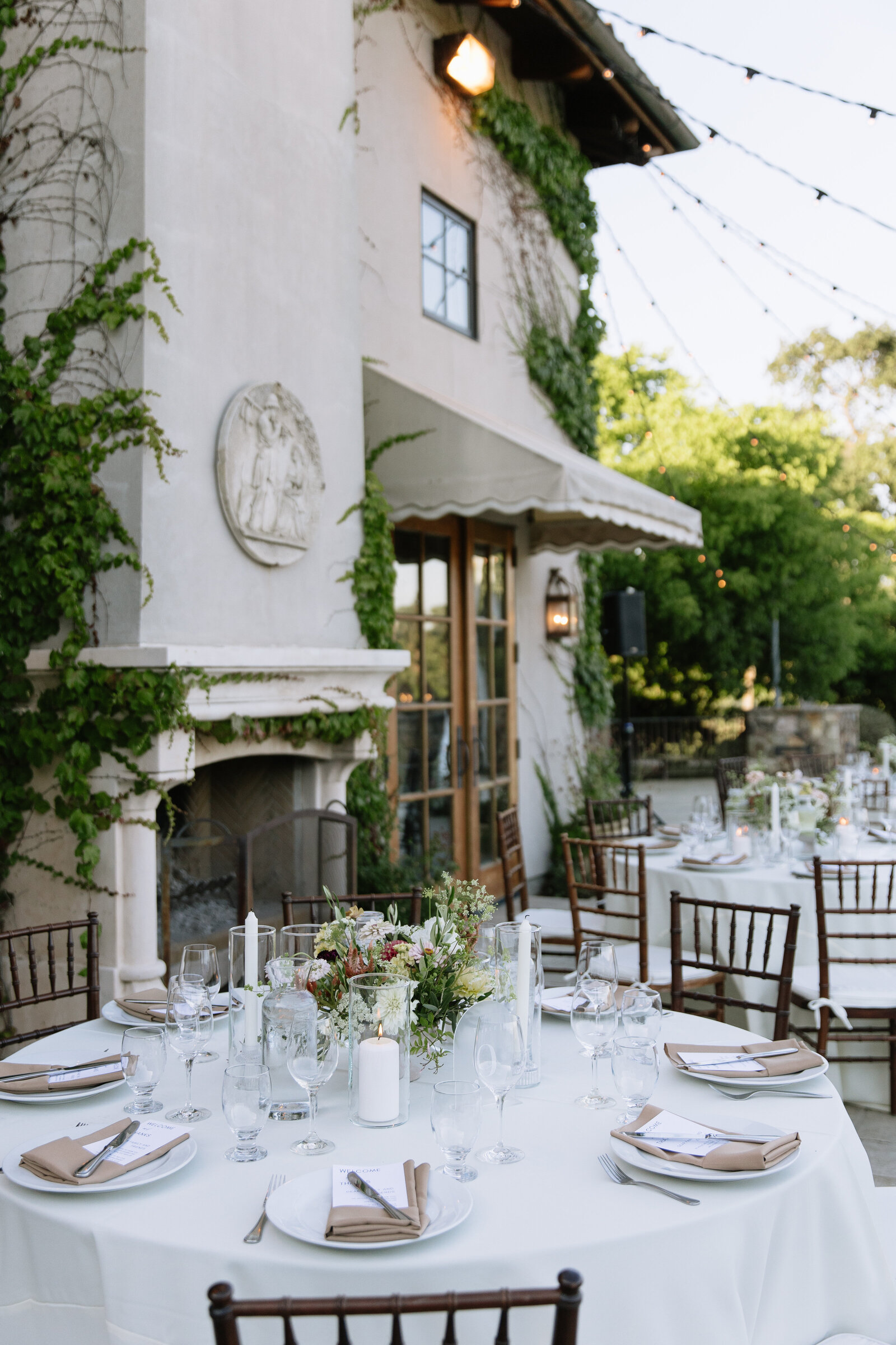 beautifully set tables with floral arrangements at Italy inspired wedding venue in California