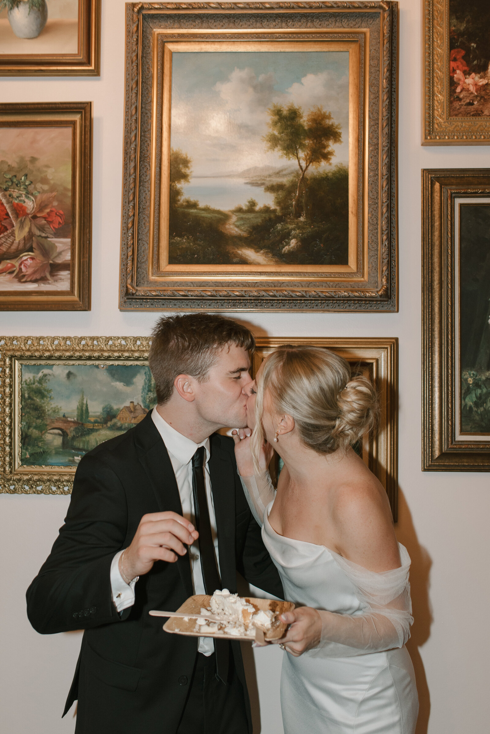 flash photo of bride and groom eating cake