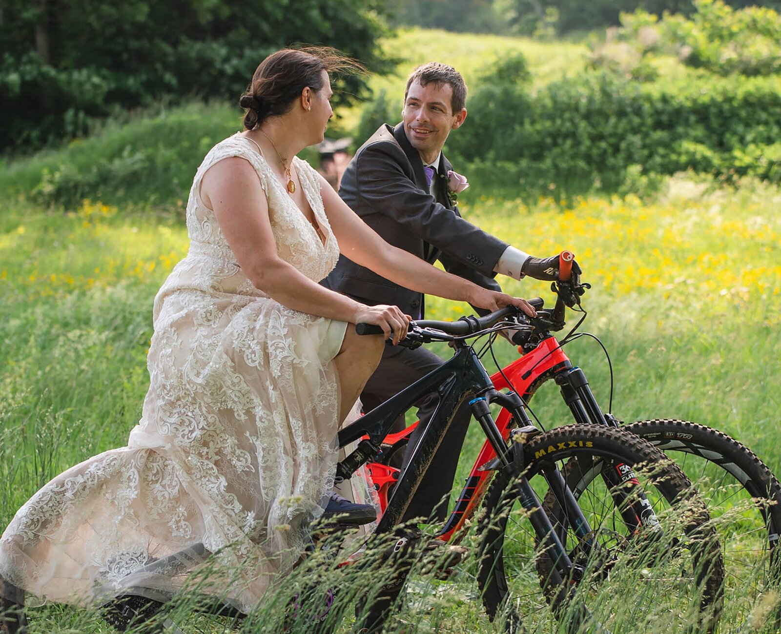 New England elopement couple on mountain bikes