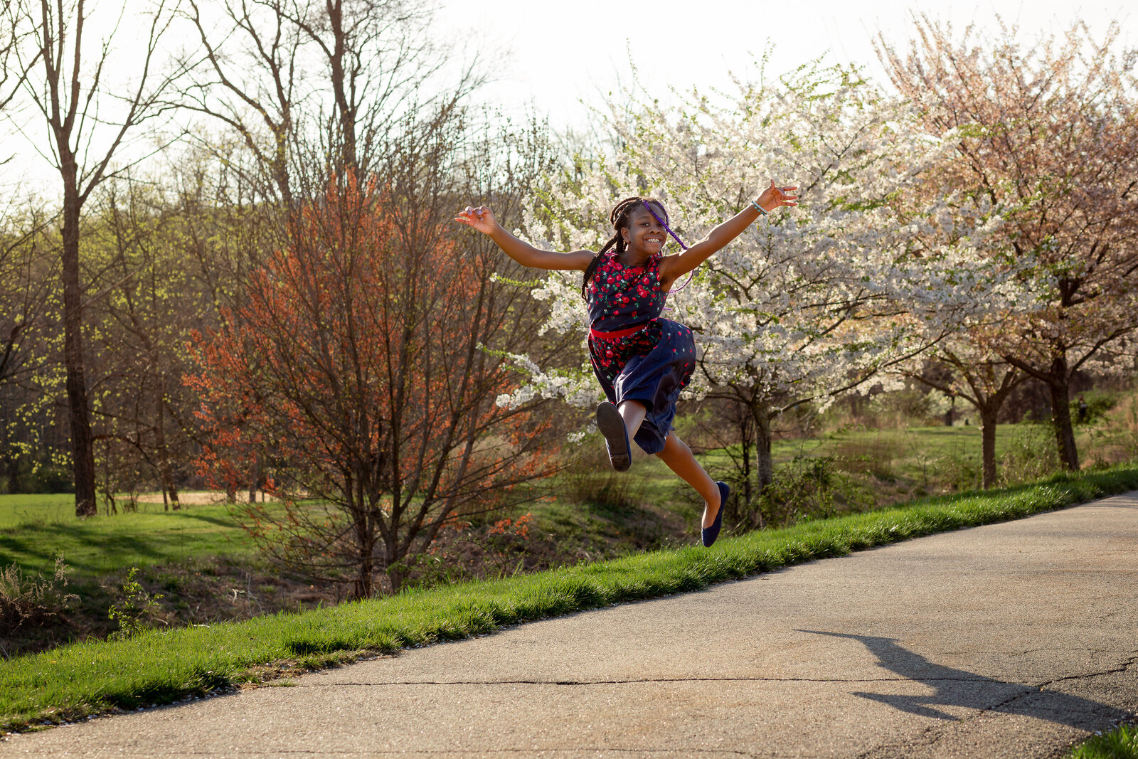 kid-jumping-central-park-morristown-family-photographers-nj