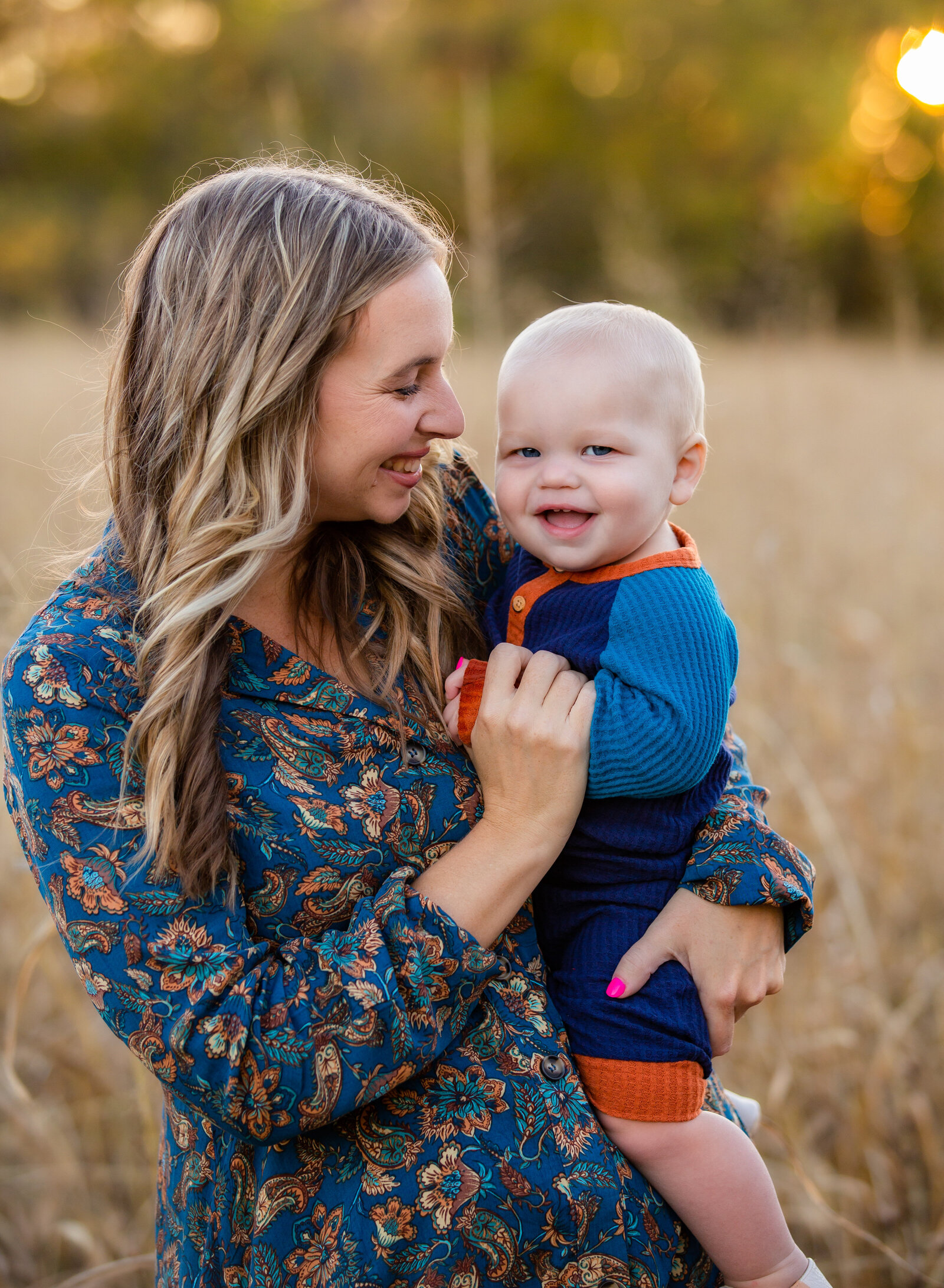 mother and baby boy laughing