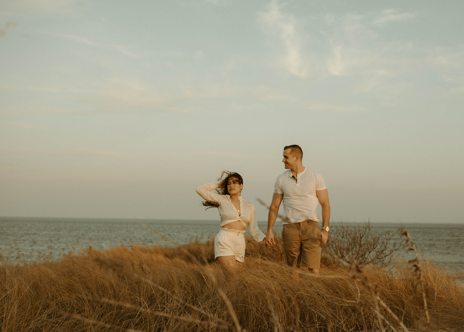 Couple by the ocean at golden hour