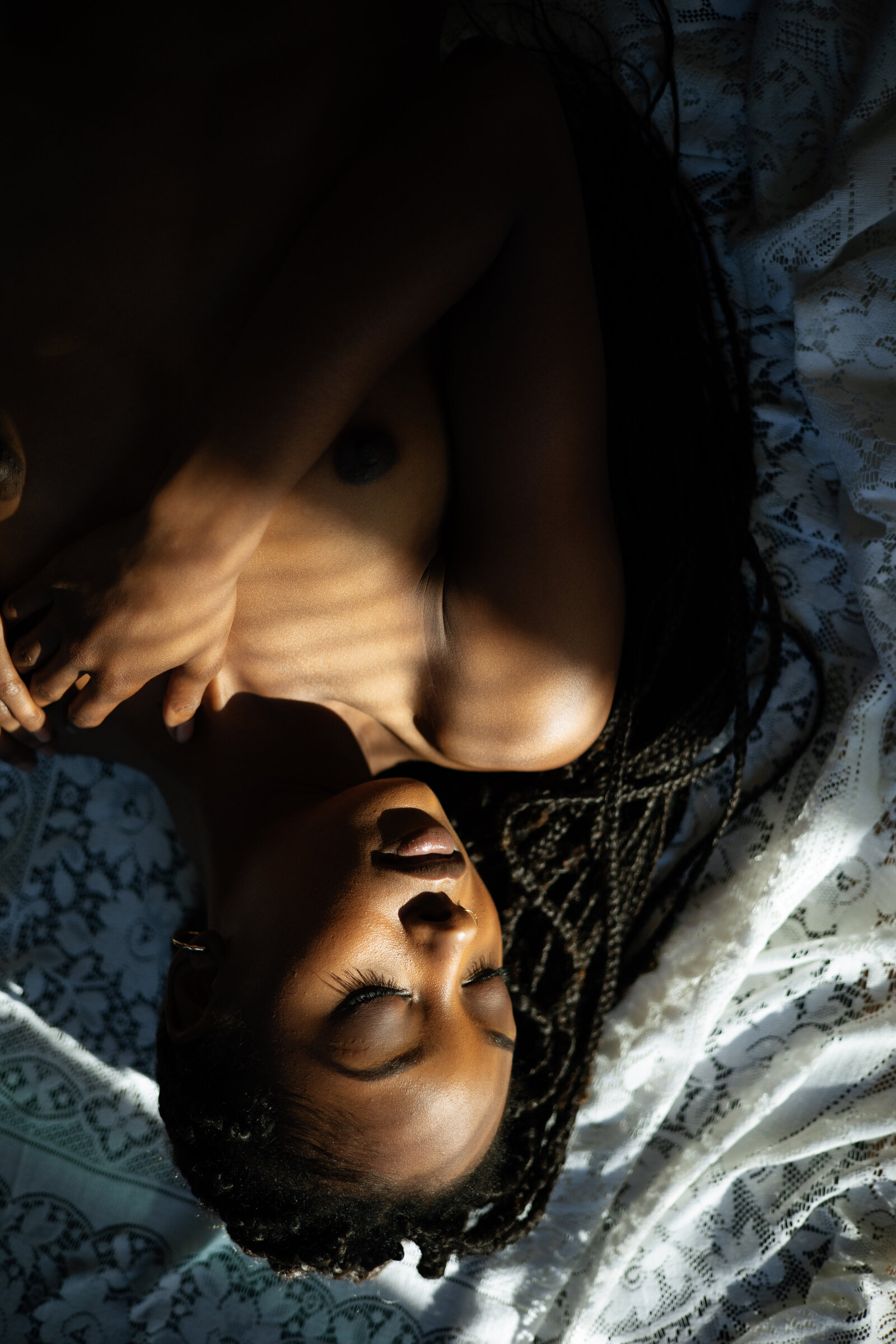 Black woman lying down with closed eyes