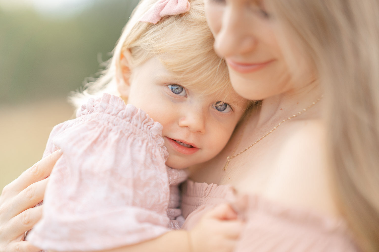 daughter laying on mom’s chest during Ashburn, Virginia minis