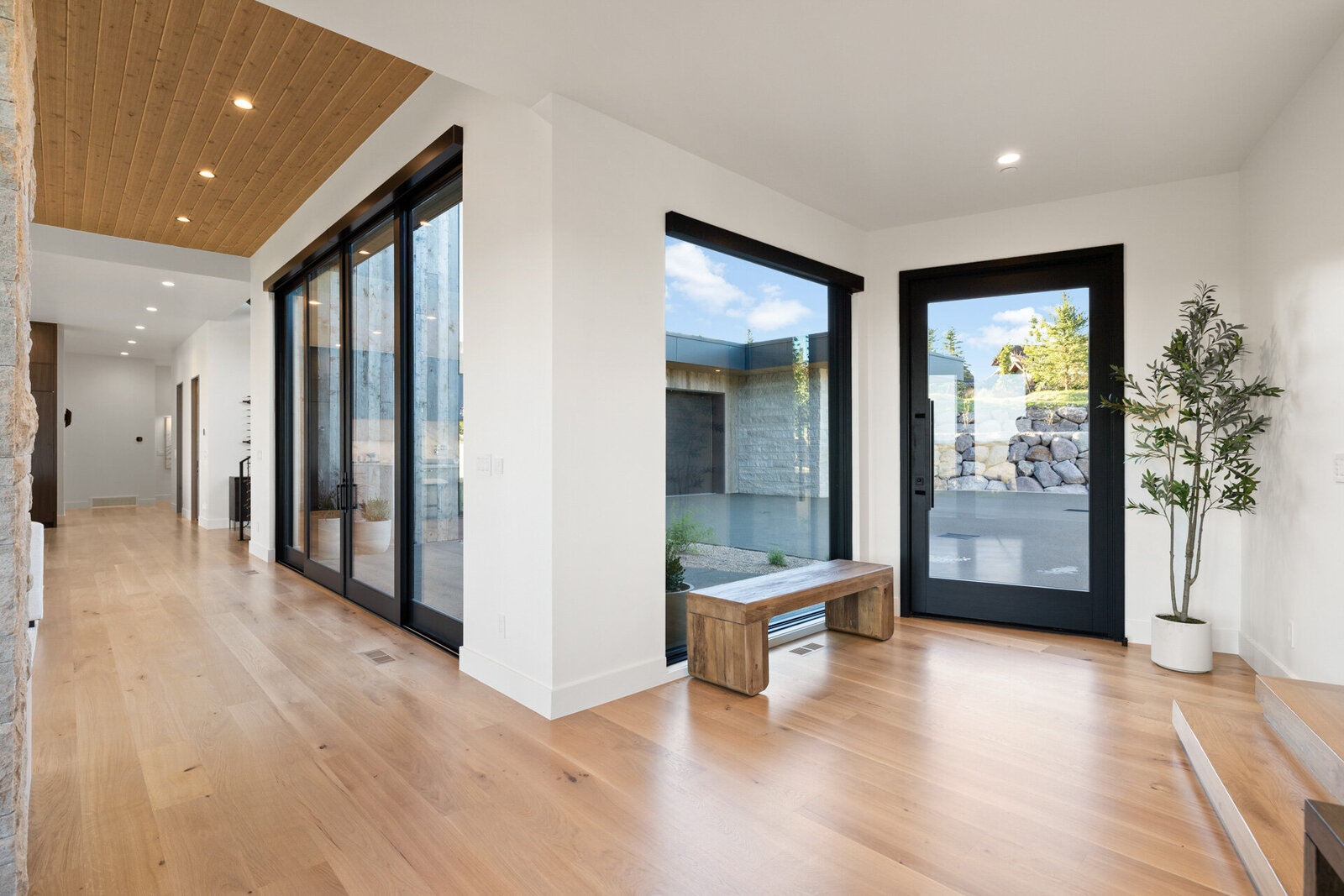 Chalet-and-Co-Park-City-Interior-Designer-large-sliding-glass-doors-wooden-bench