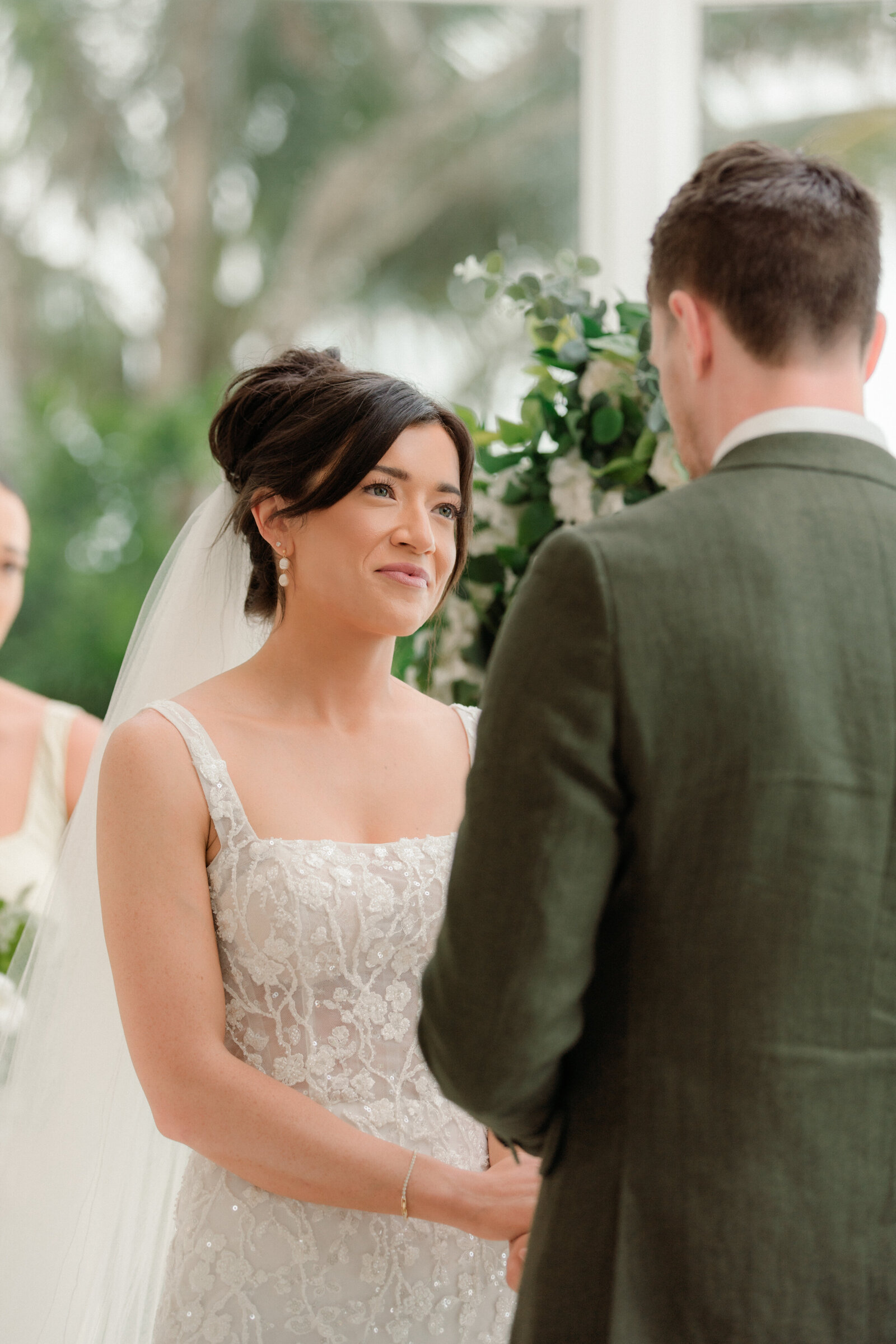 Bride looking at groom during ceremony