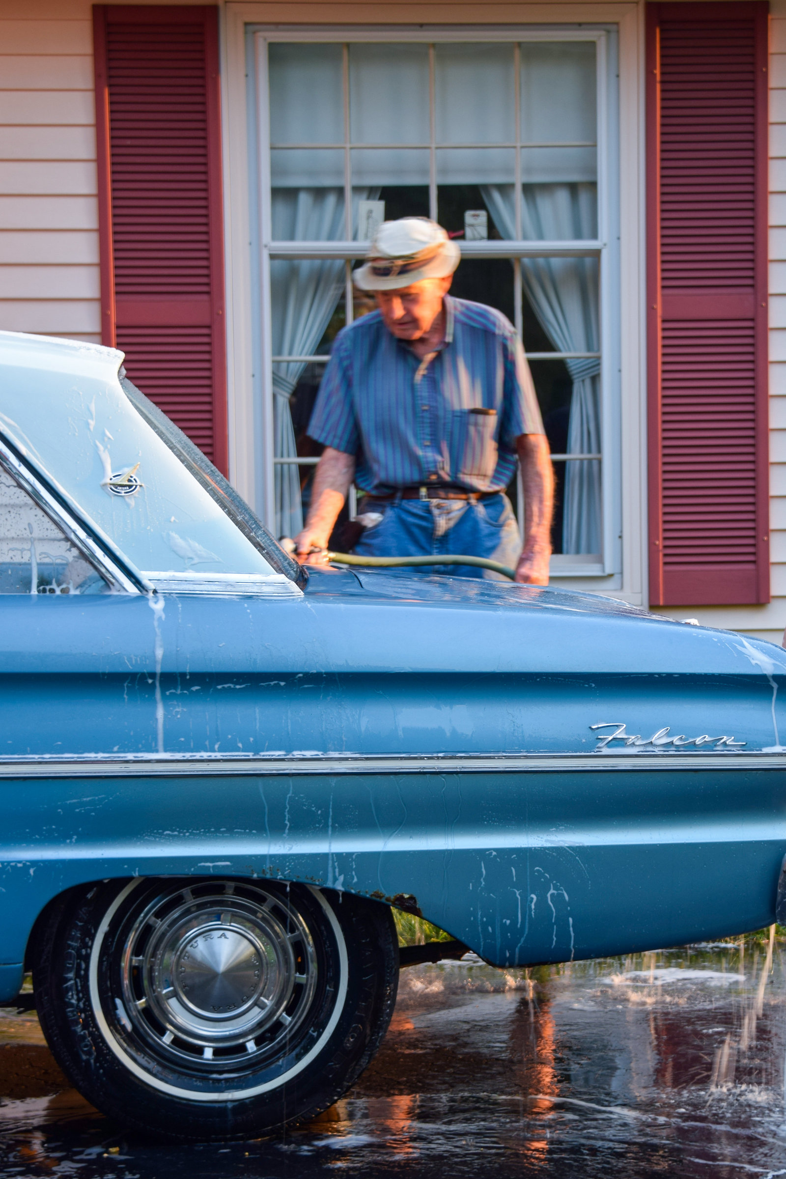 Vintage blue Ford Falcon car wash