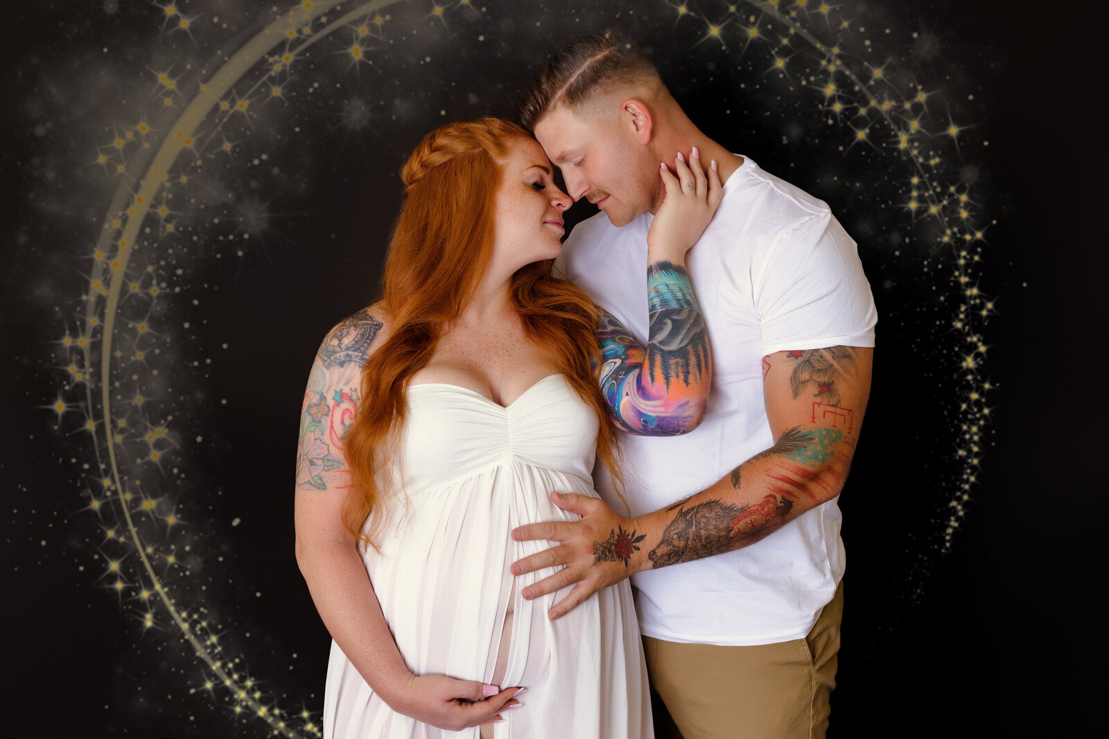 Maternity Photographer, a young father and mother-to-be embrace