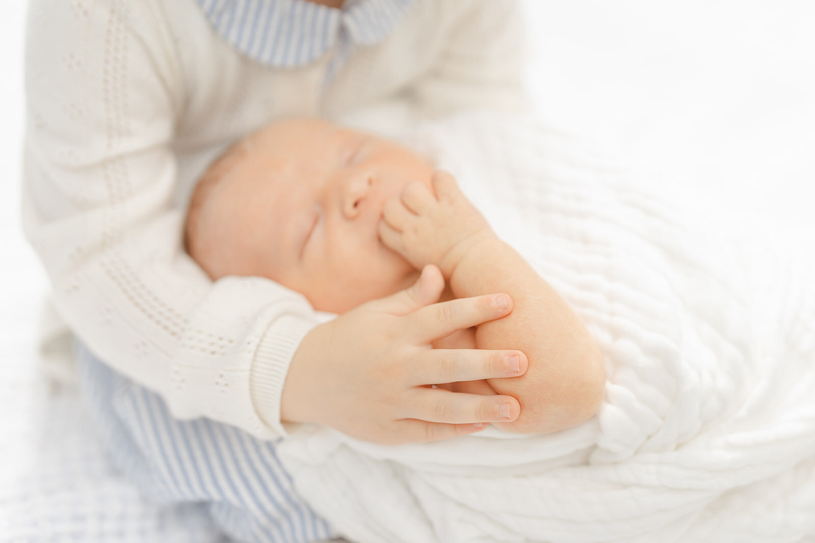 big sister touching baby during newborn photo in Leesburg, Virginia