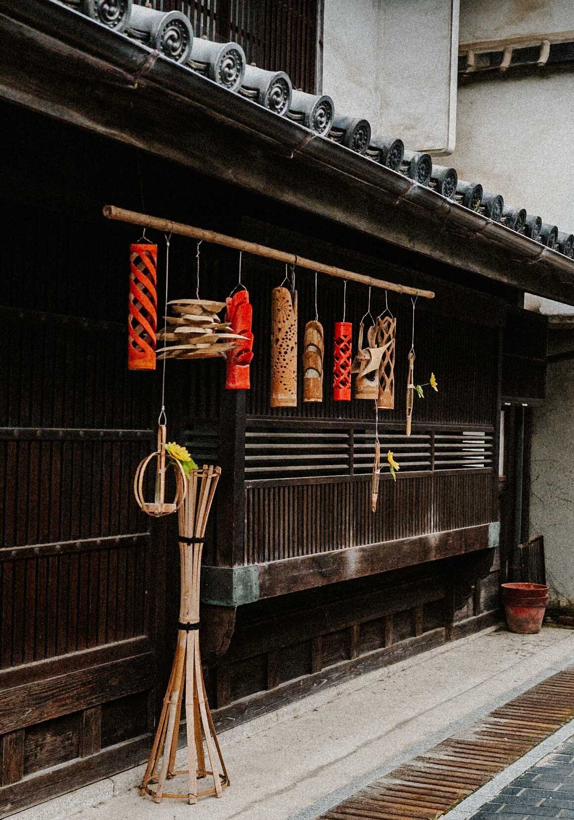 Unique handmade vase crafted from bamboo, displayed in Takehara, Hiroshima as part of traditional Japanese decor.