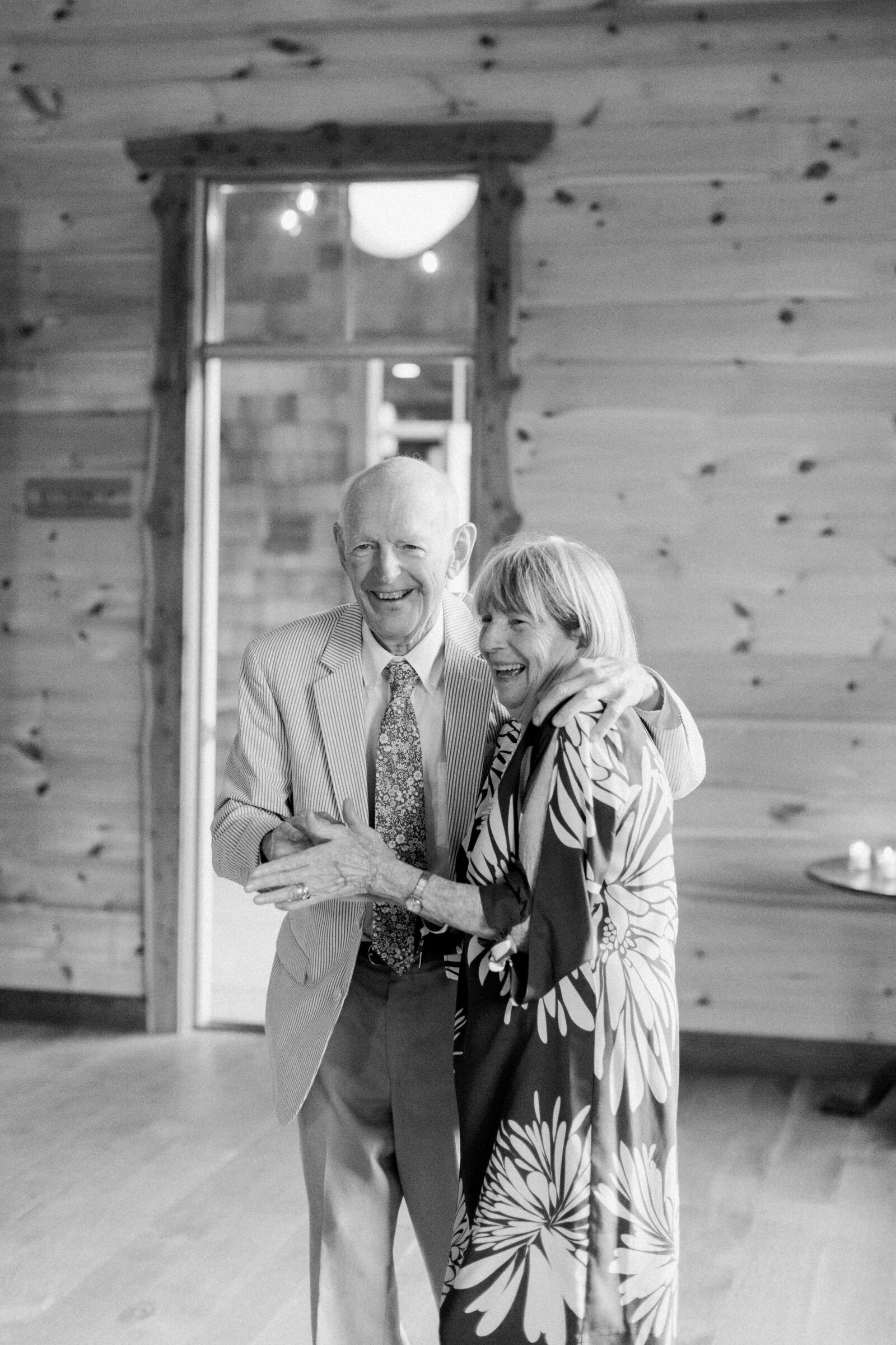 Black and white photo of an older couple dancing.