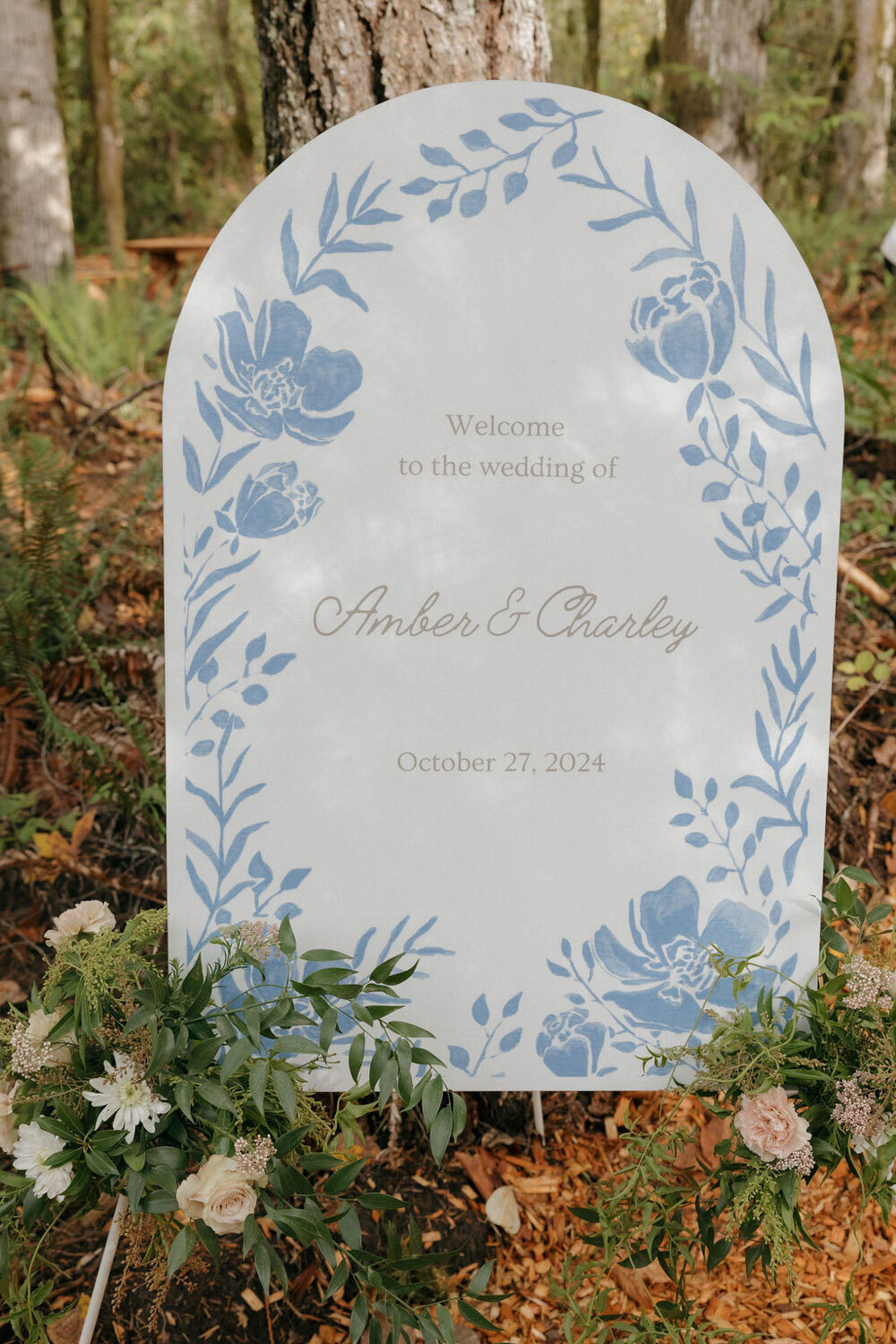 Wedding welcome sign for Amber and Charley with blue floral design