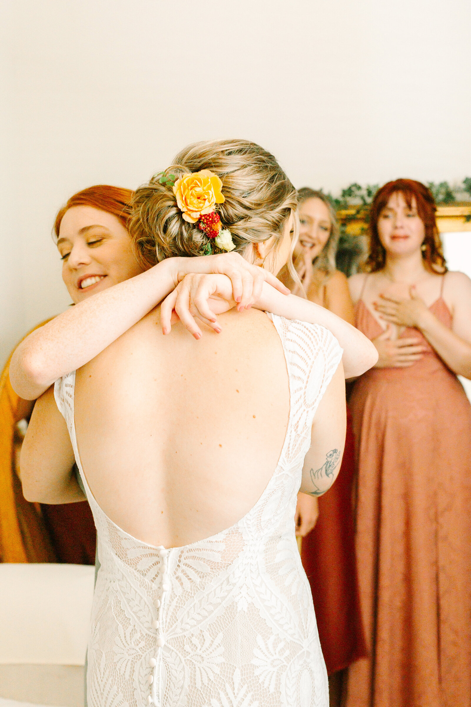 Bride getting ready on her colorful wedding day in Santa Cruz, California in the redwood trees.