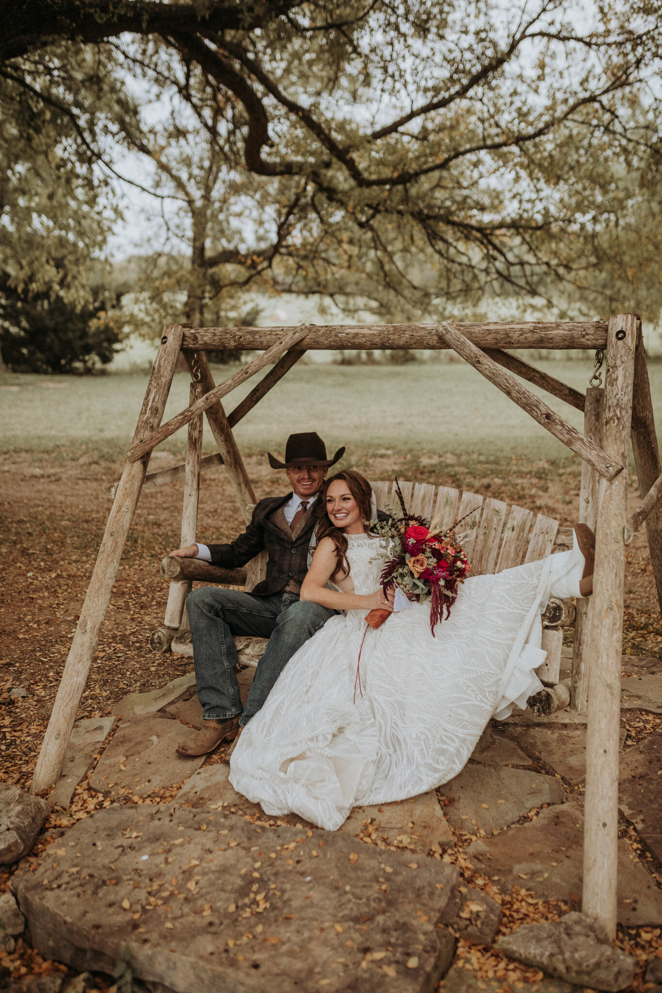 texas wedding couple in wooden swing