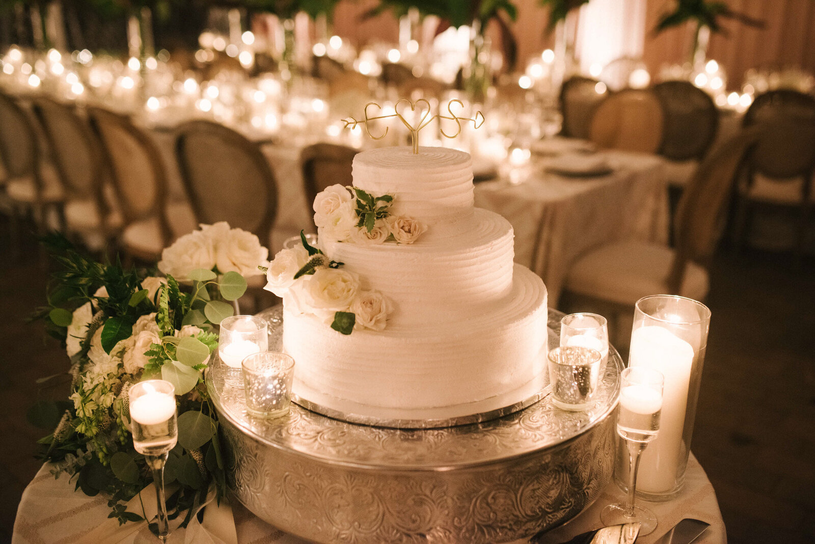 Elegant white wedding cake with flower details