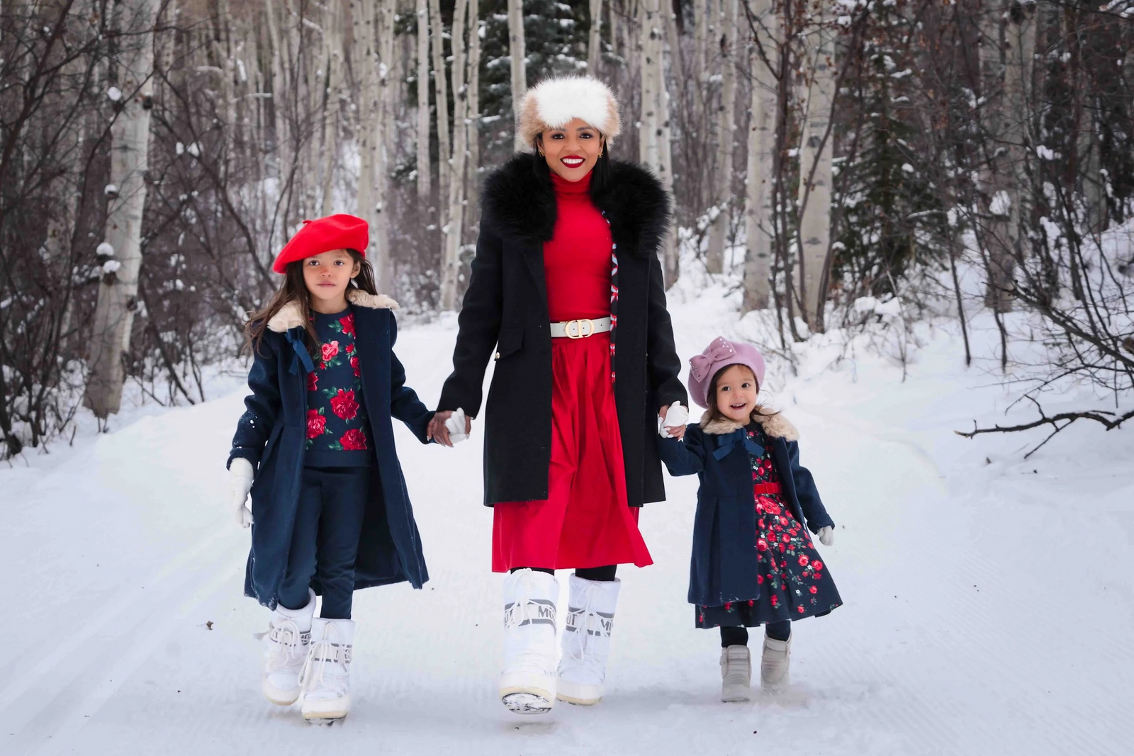 Family portrait in a snowy Aspen forest