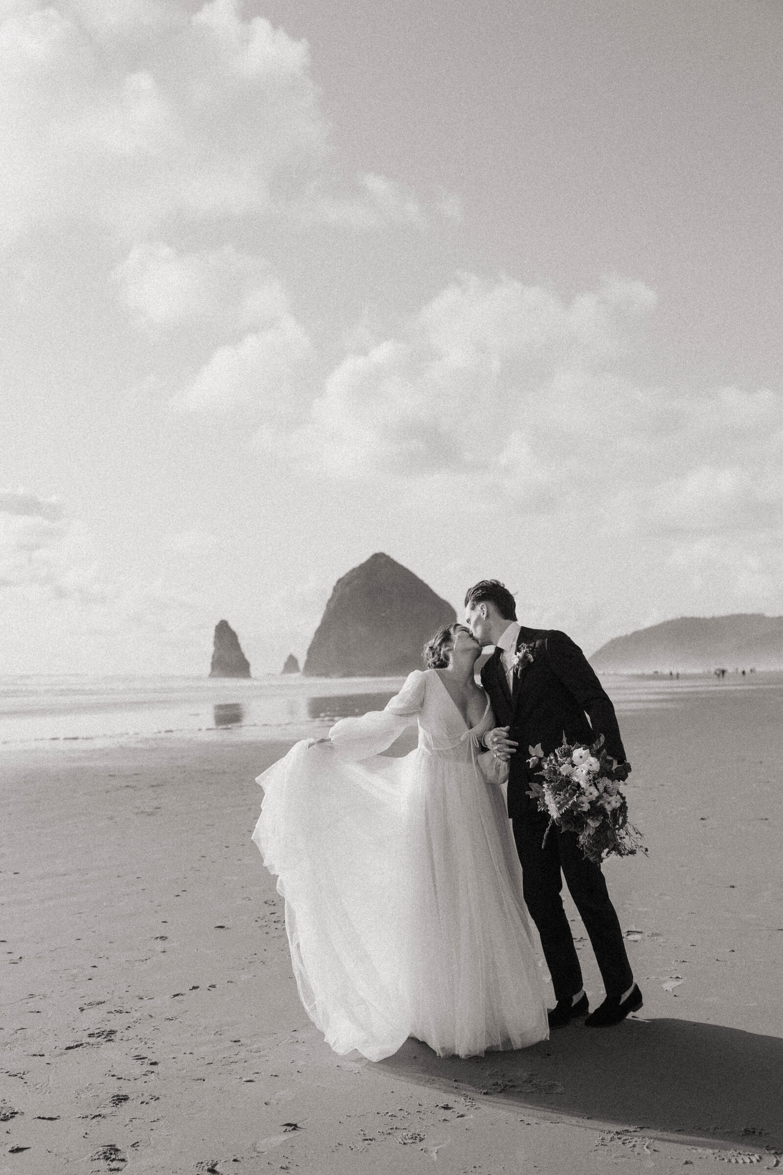 A couple kissing after their elopement in Oregon with their photographer.