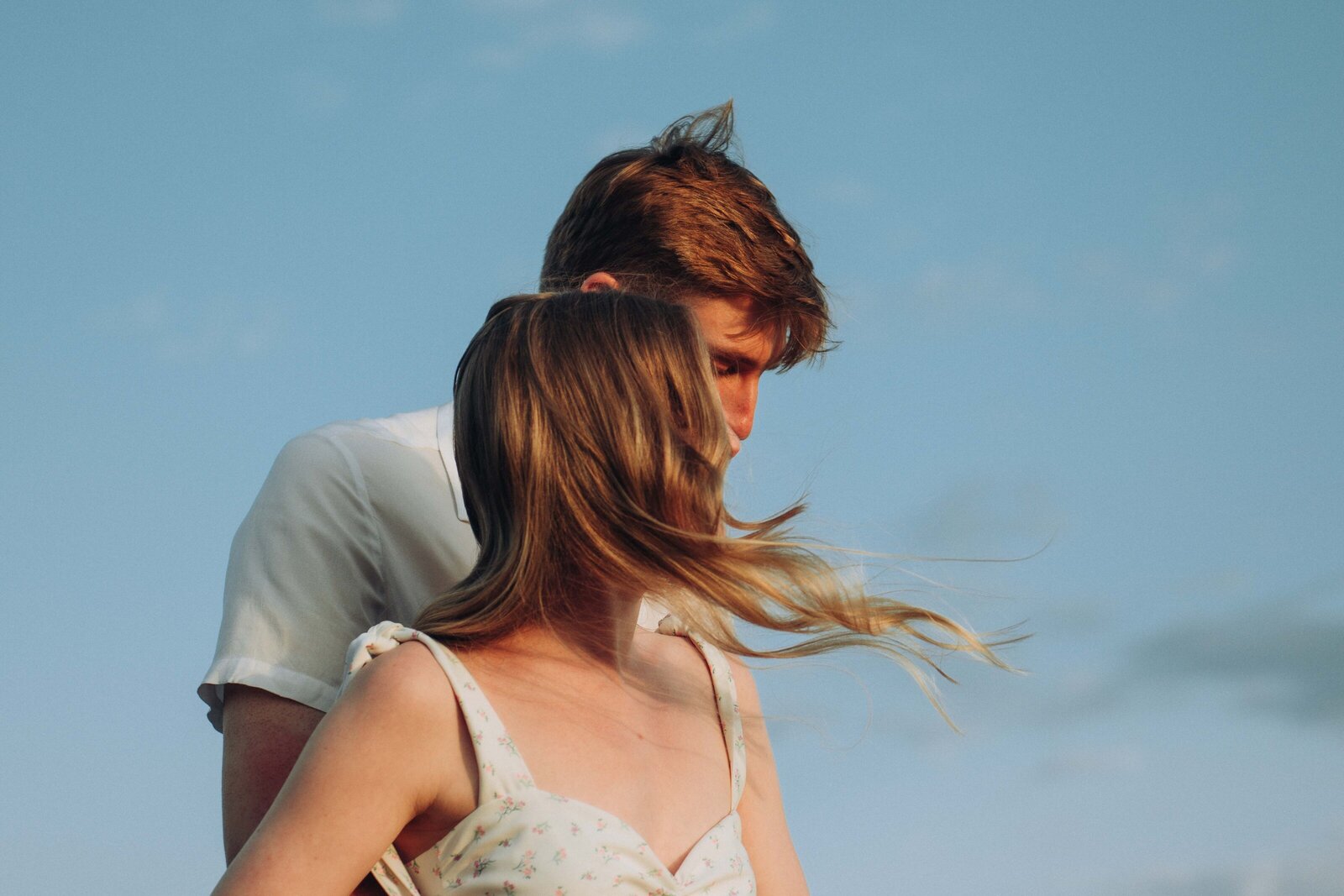 Couple embracing in the wind on Margate beach