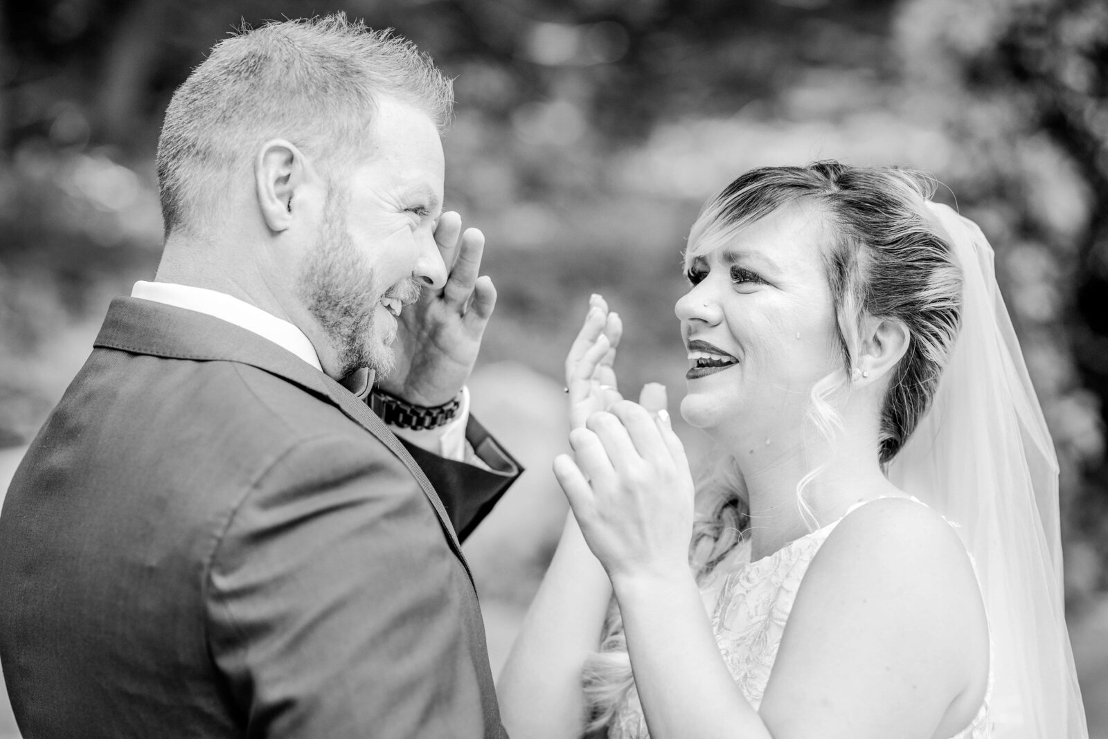 Bride and groom sharing an emotional and teary first look before they walk down the aisle.