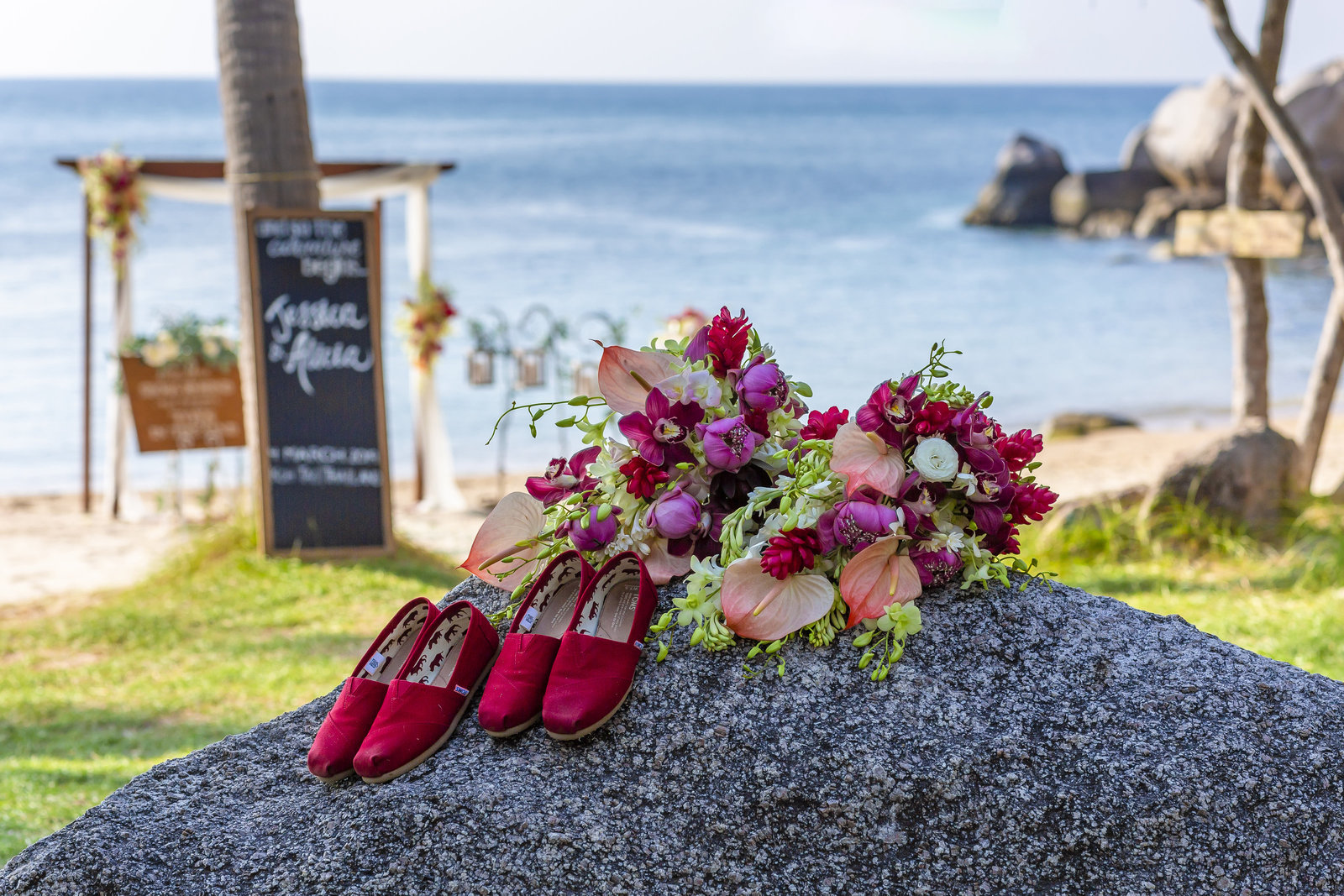 Toms shoes and flowers on a rock