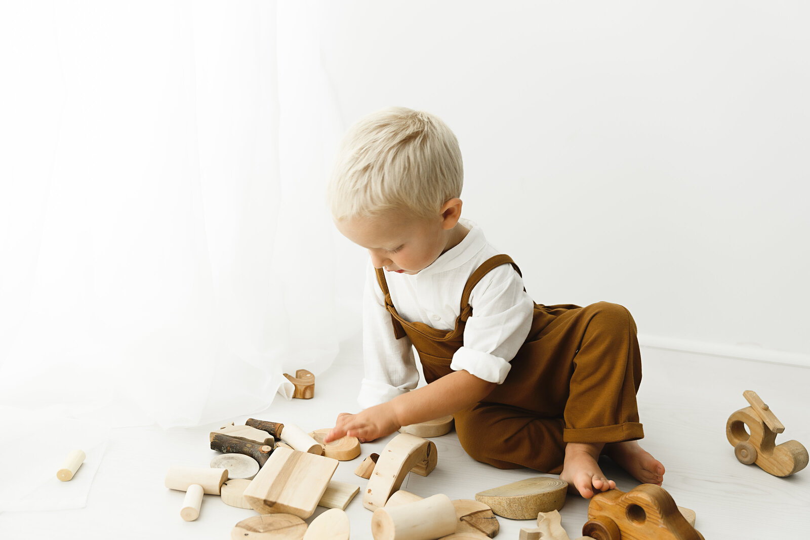 toddler playing with wooden blocks